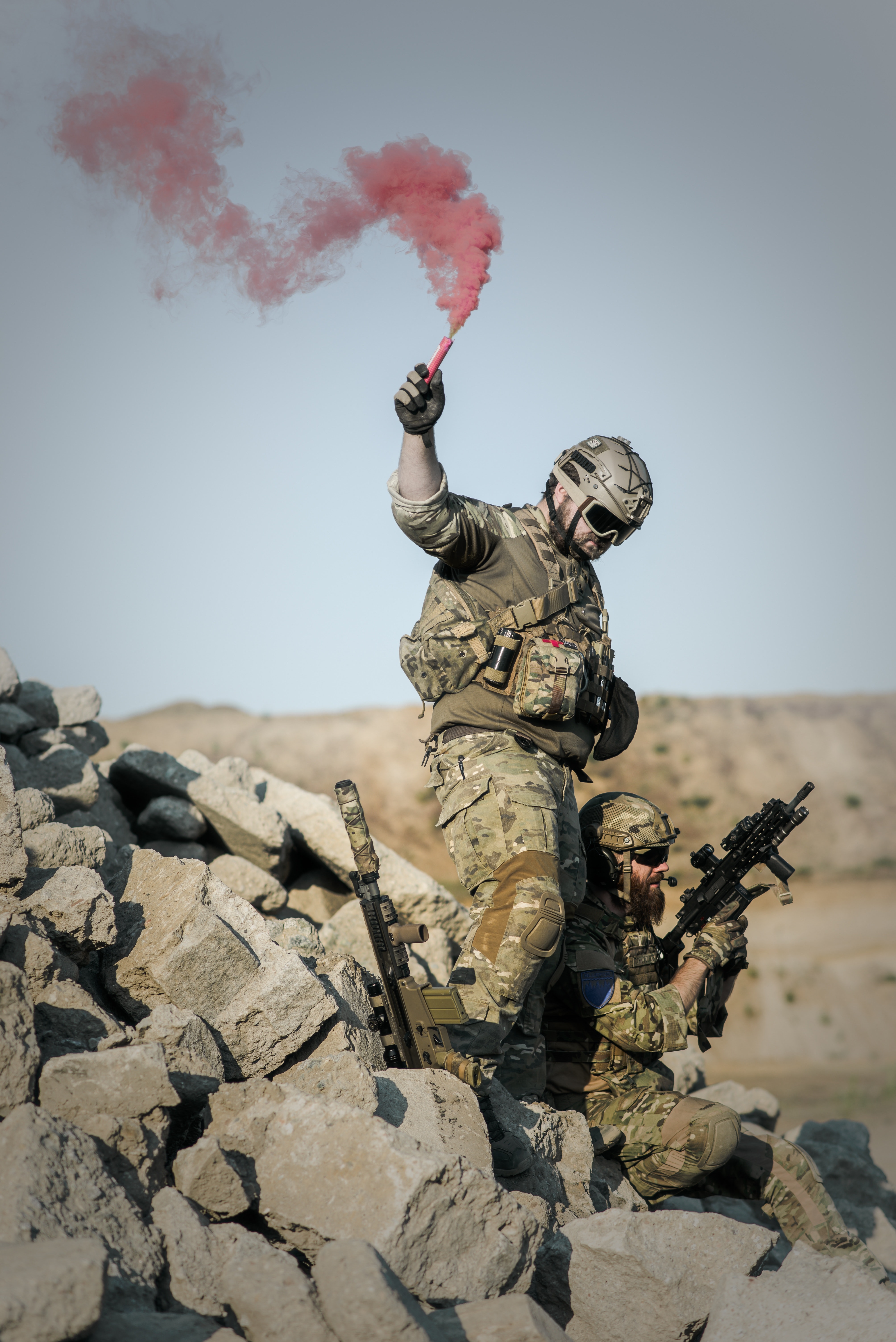 2 Soldier With Guns on Grey Pile of Rocks Holding Smoke Stick during Daytime, Police, Uniform, Team, Soldiers, HQ Photo