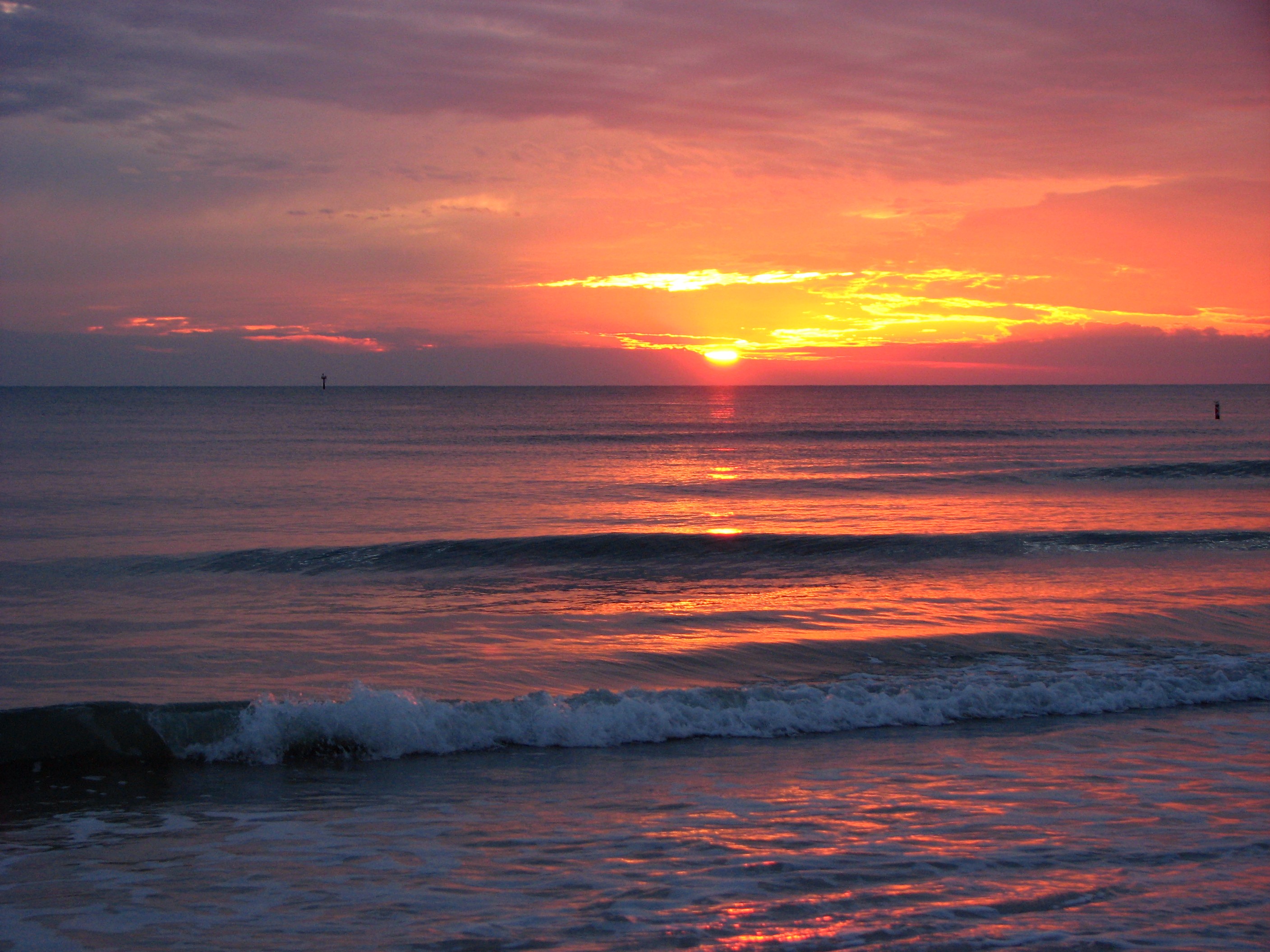 A beach and ocean sunset photo