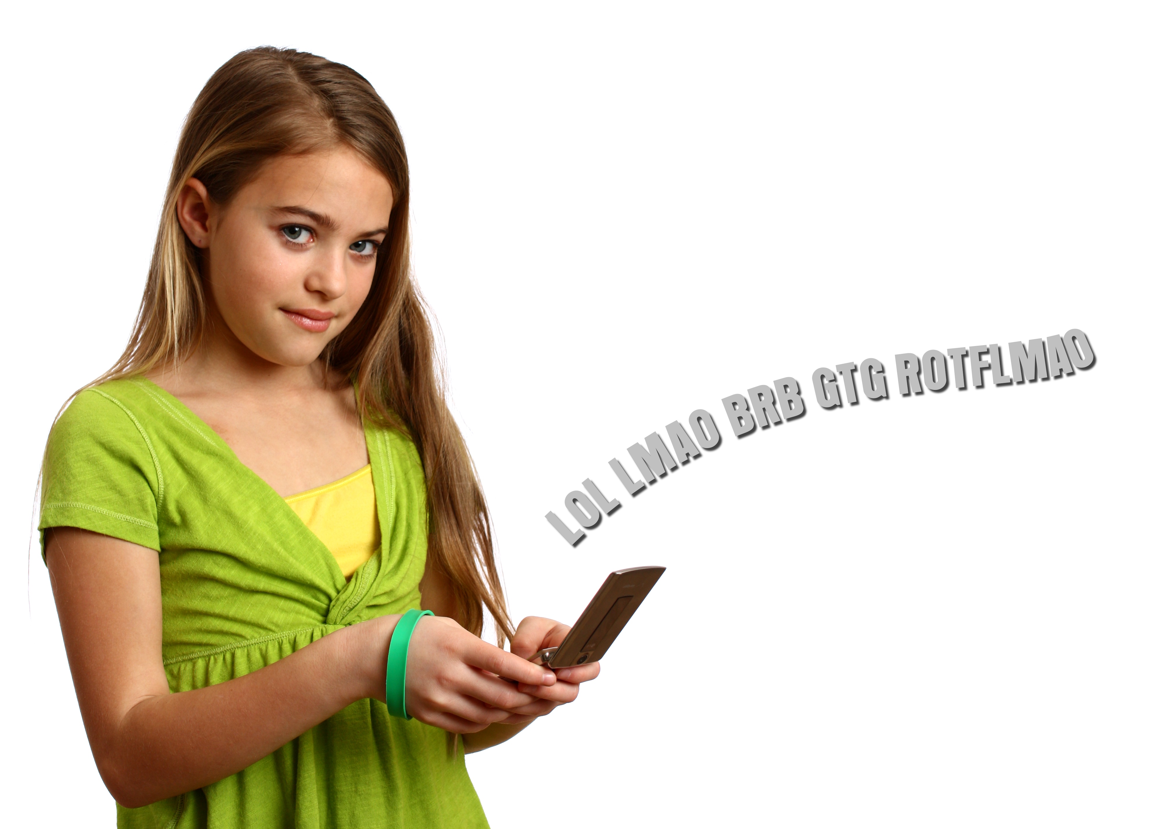 A beautiful young girl texting on a cell photo