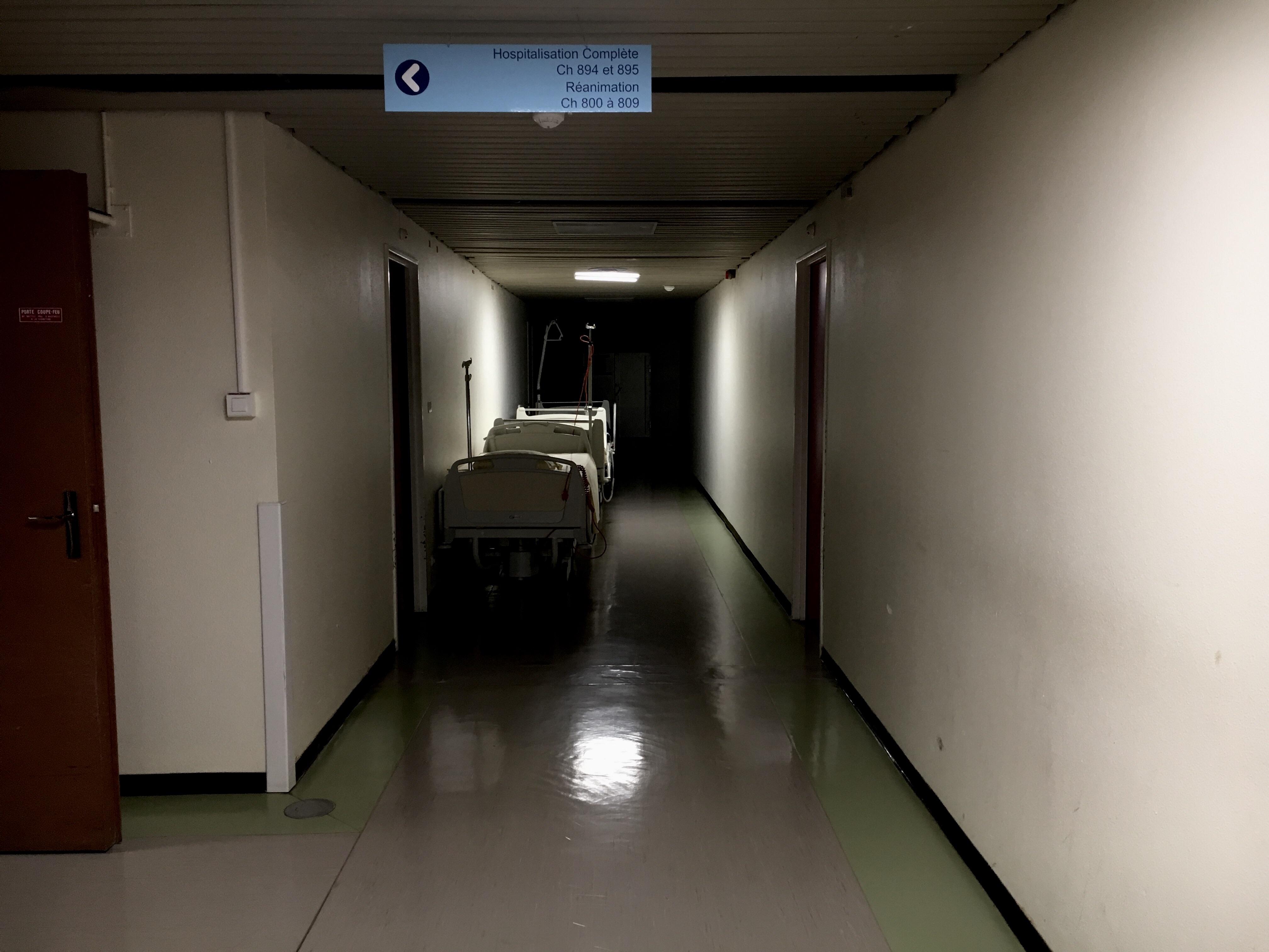 Took this photo in a hospital. A corridor with a dark end looks like ...