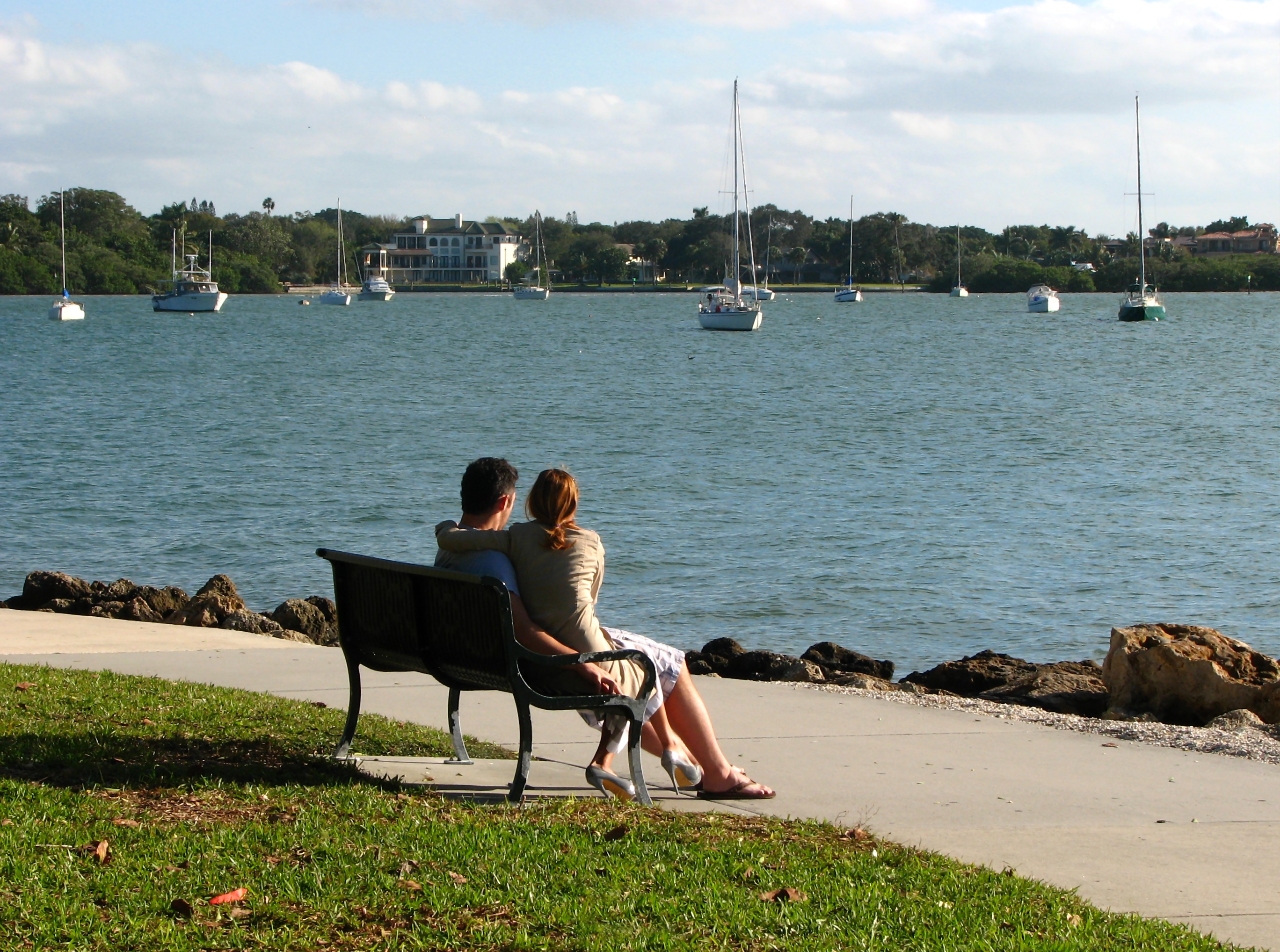 A couple sitting on a bench photo