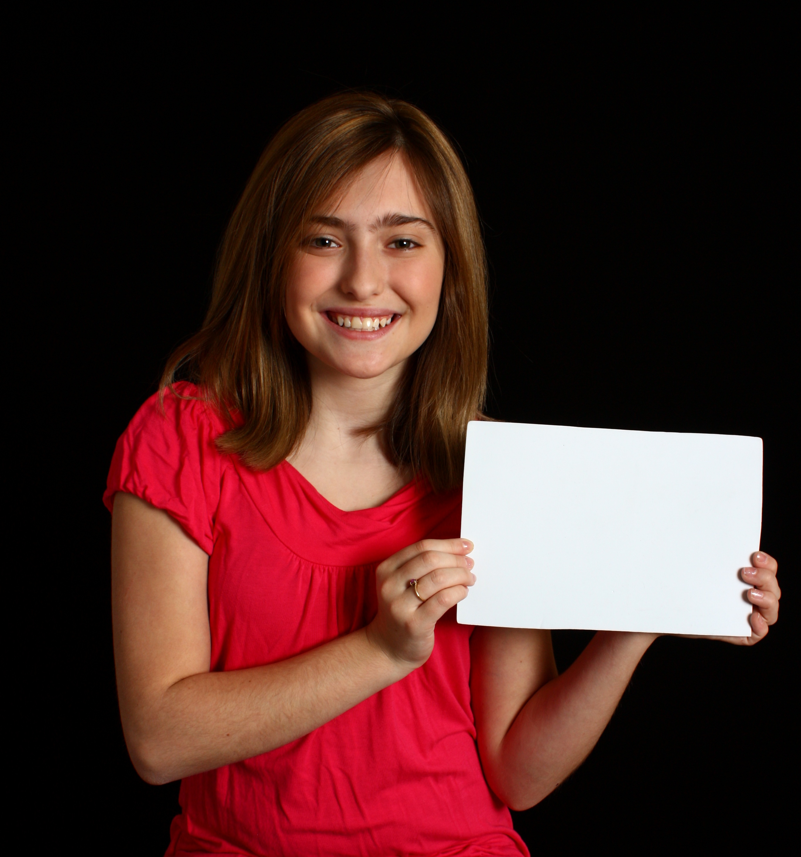 A cute young girl holding a blank sign photo