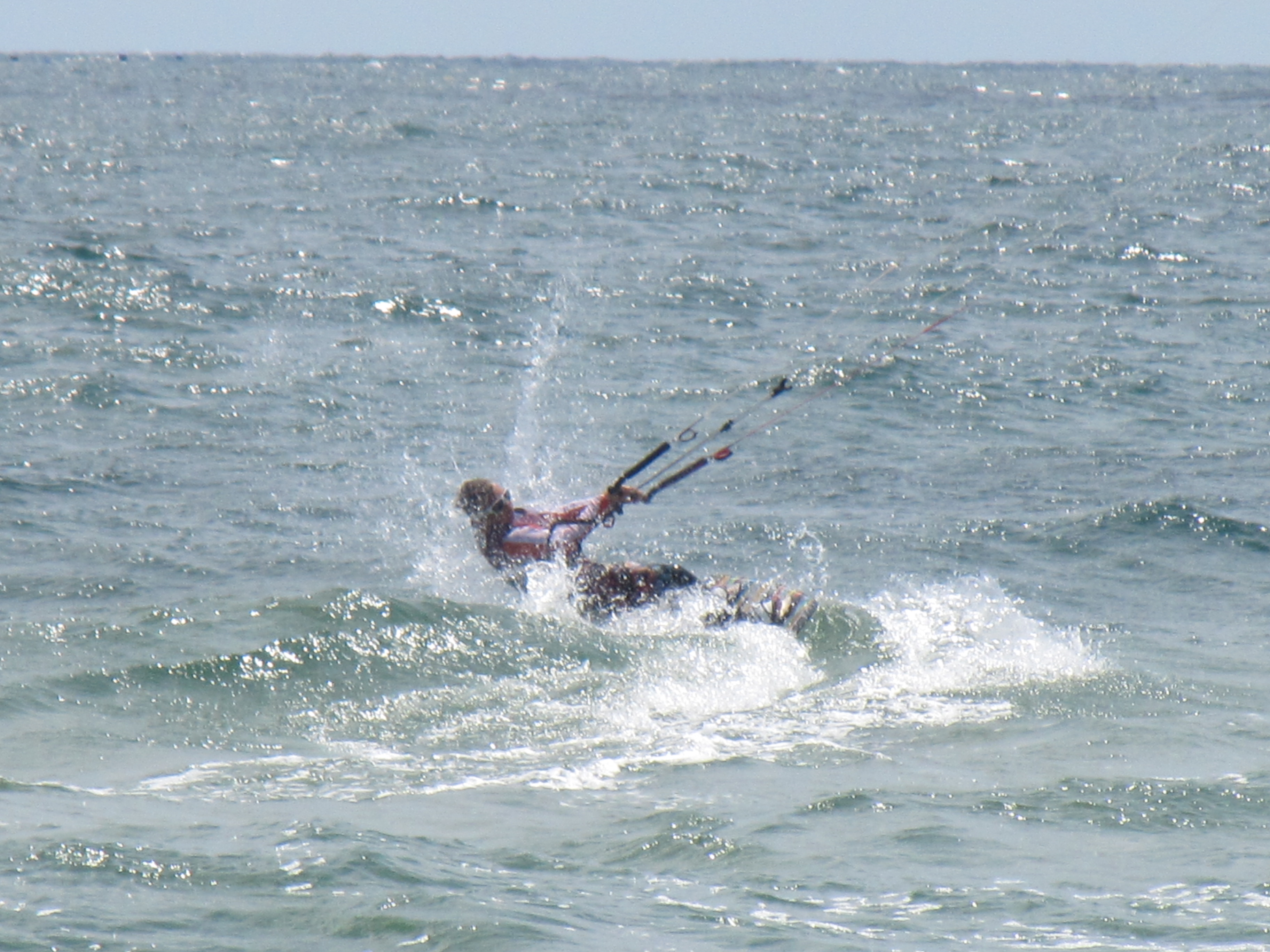 A kitesurfer at sea photo