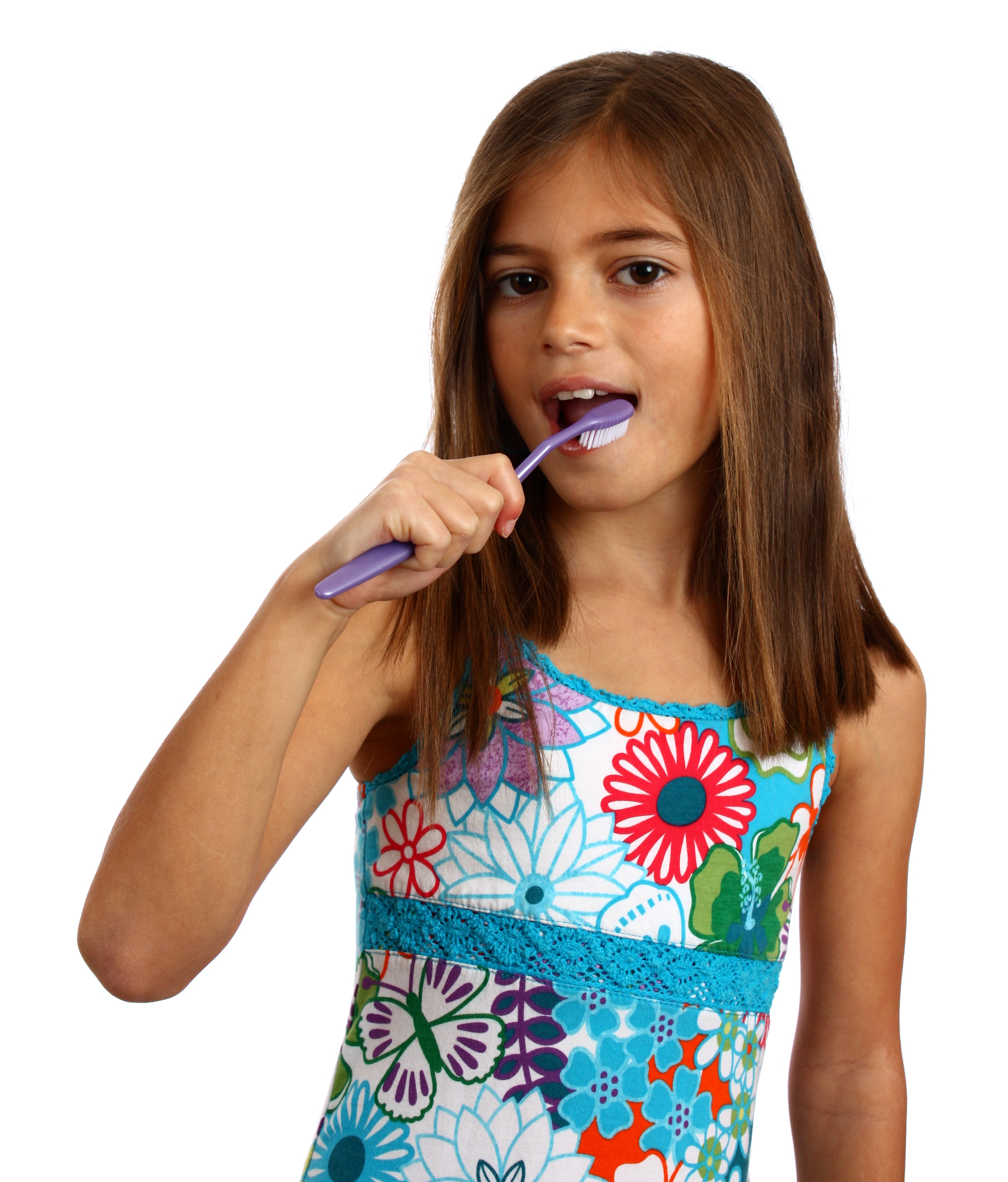 A pretty young girl brushing her teeth photo
