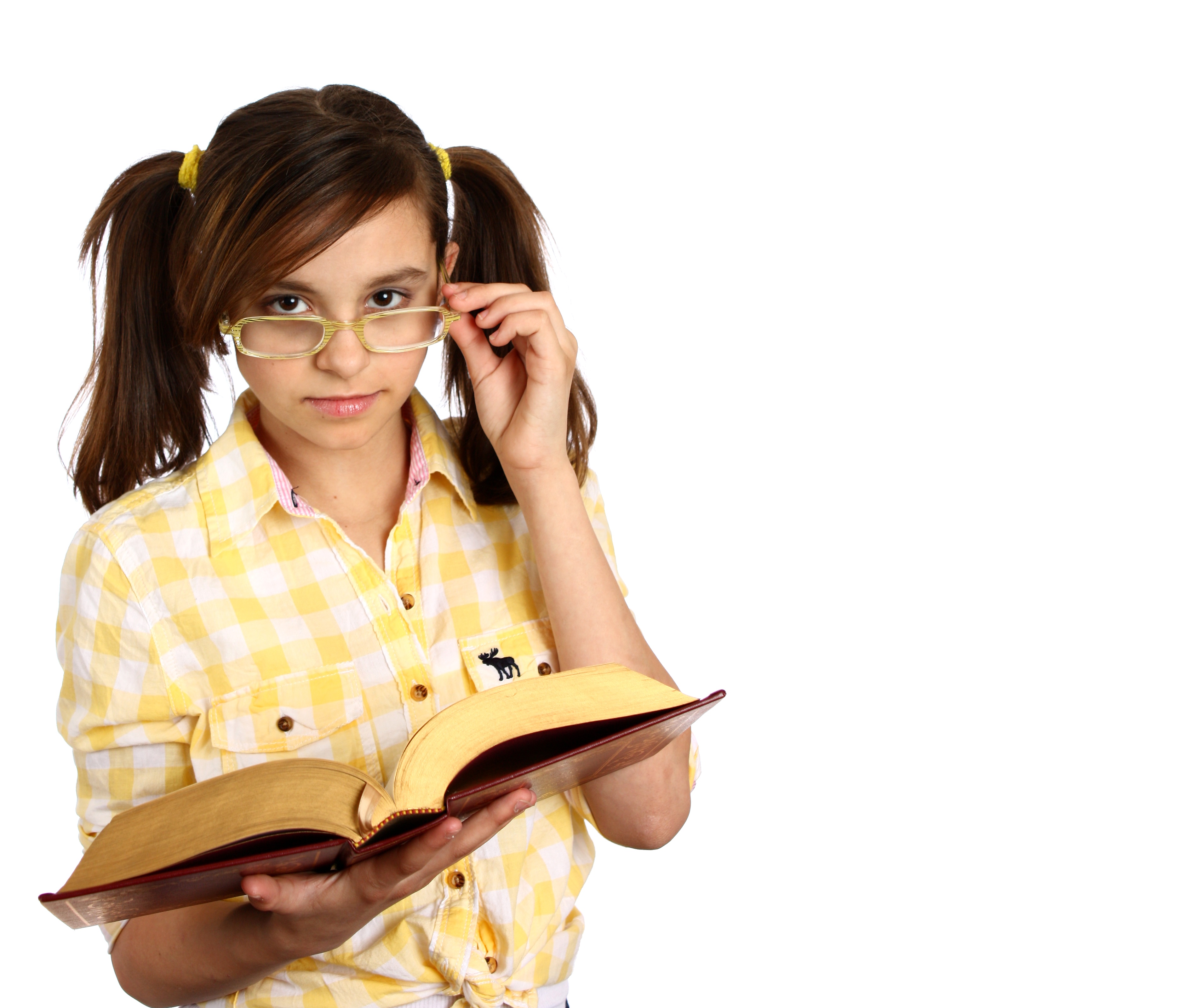 A smart girl with glasses reading a book photo