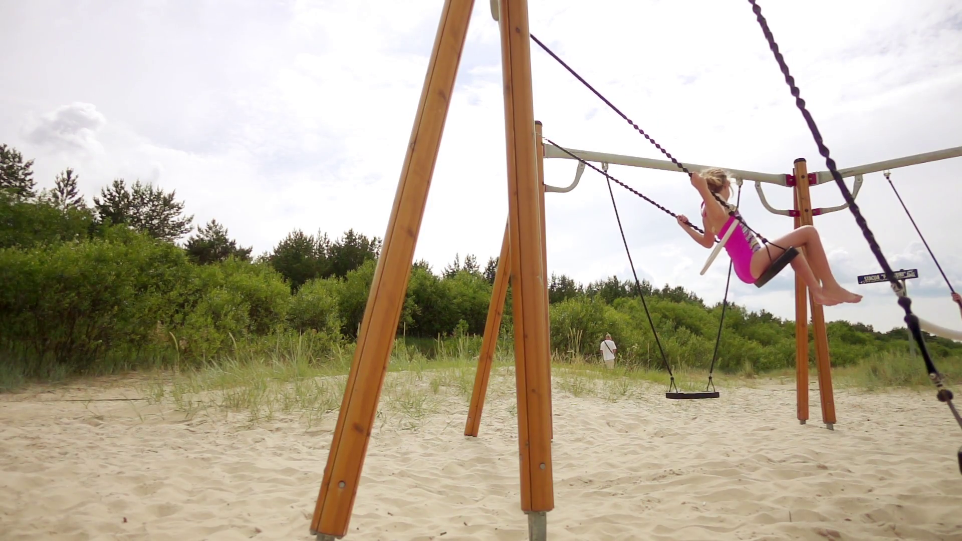 Slow Motion: Beautiful little girl on a swing Baltic Sea in Jurmala ...