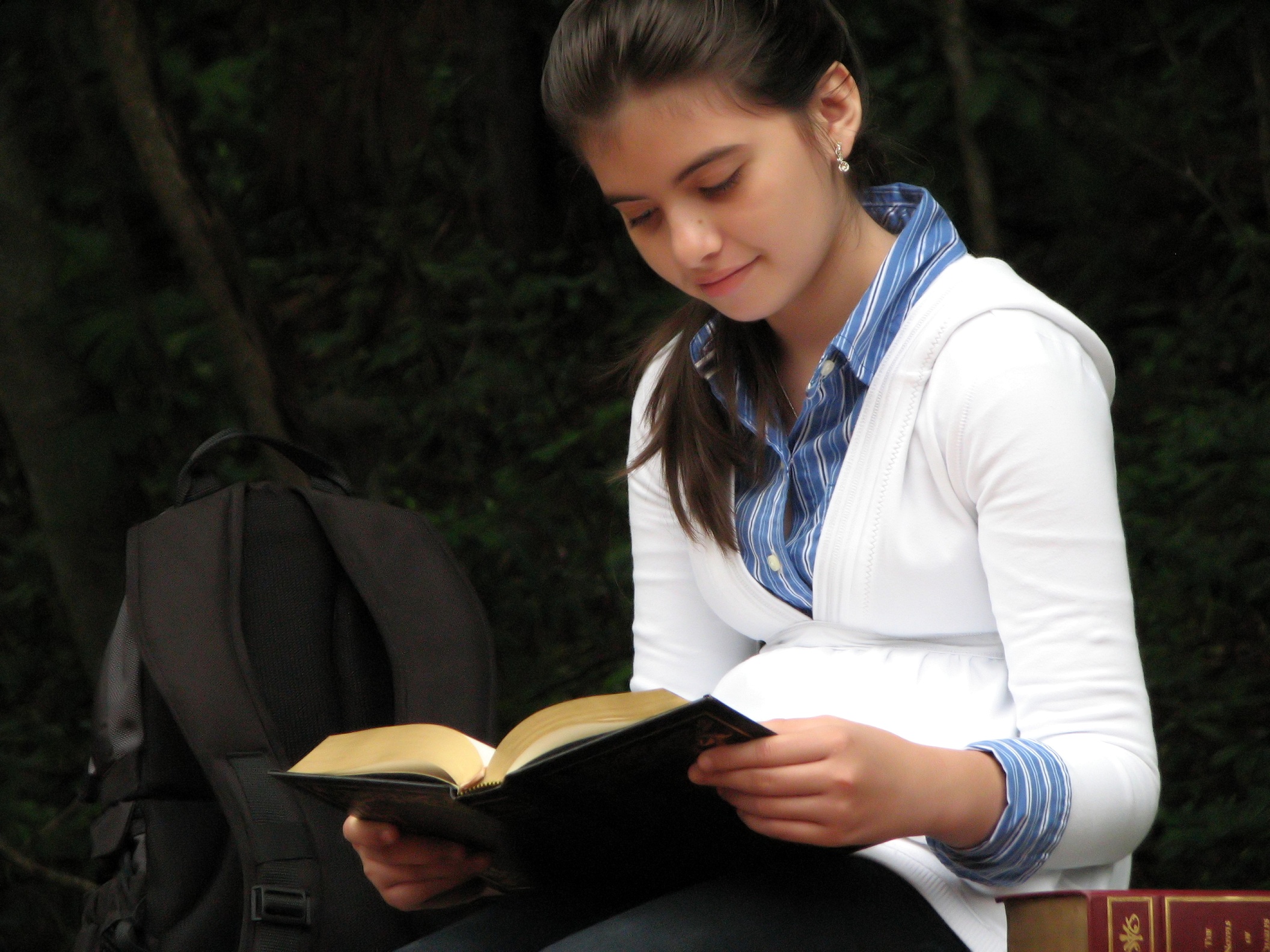 A young schoolgirl reading a book photo