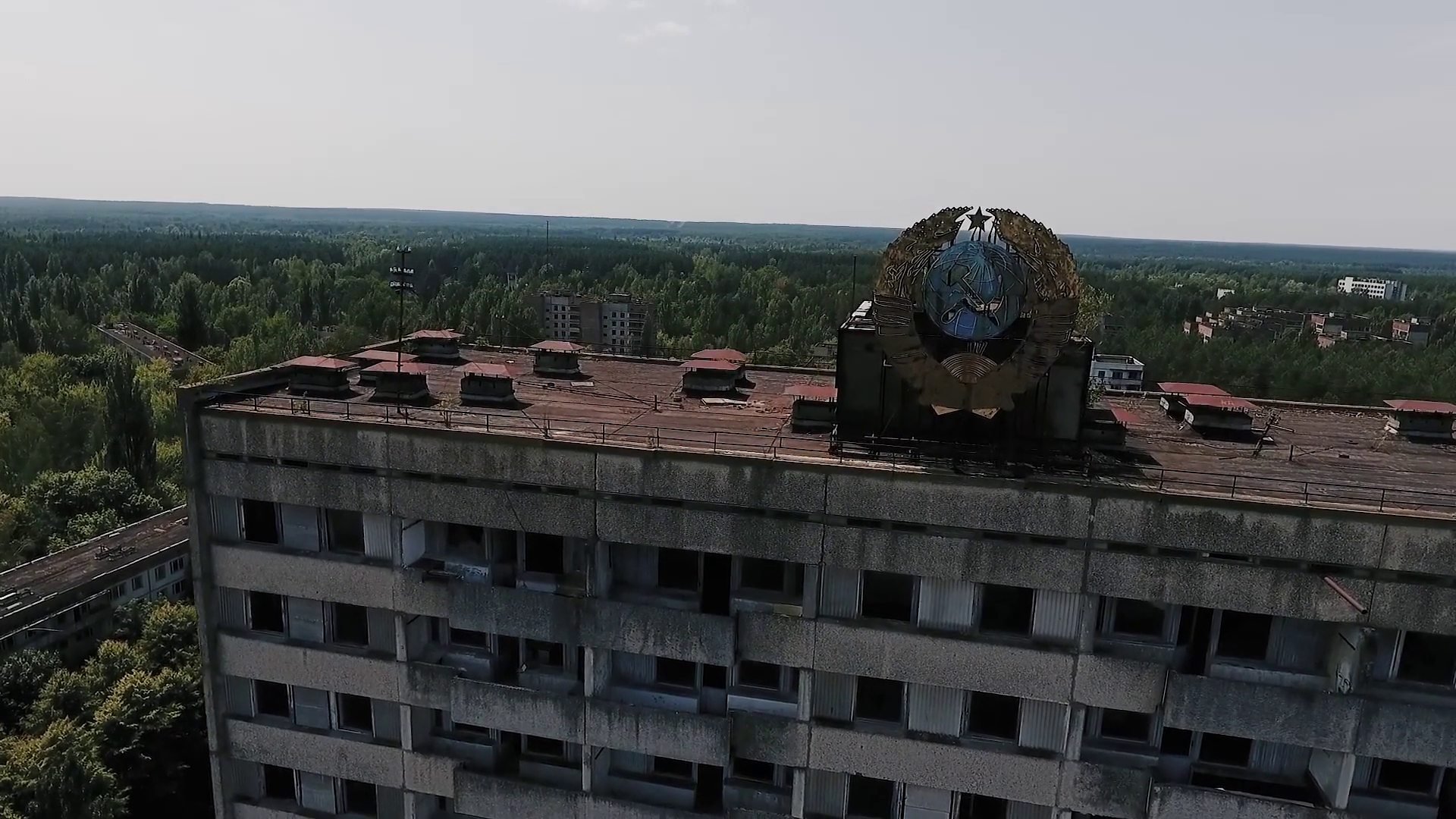 Abandoned building with the Soviet coat of arms on the facade in the ...