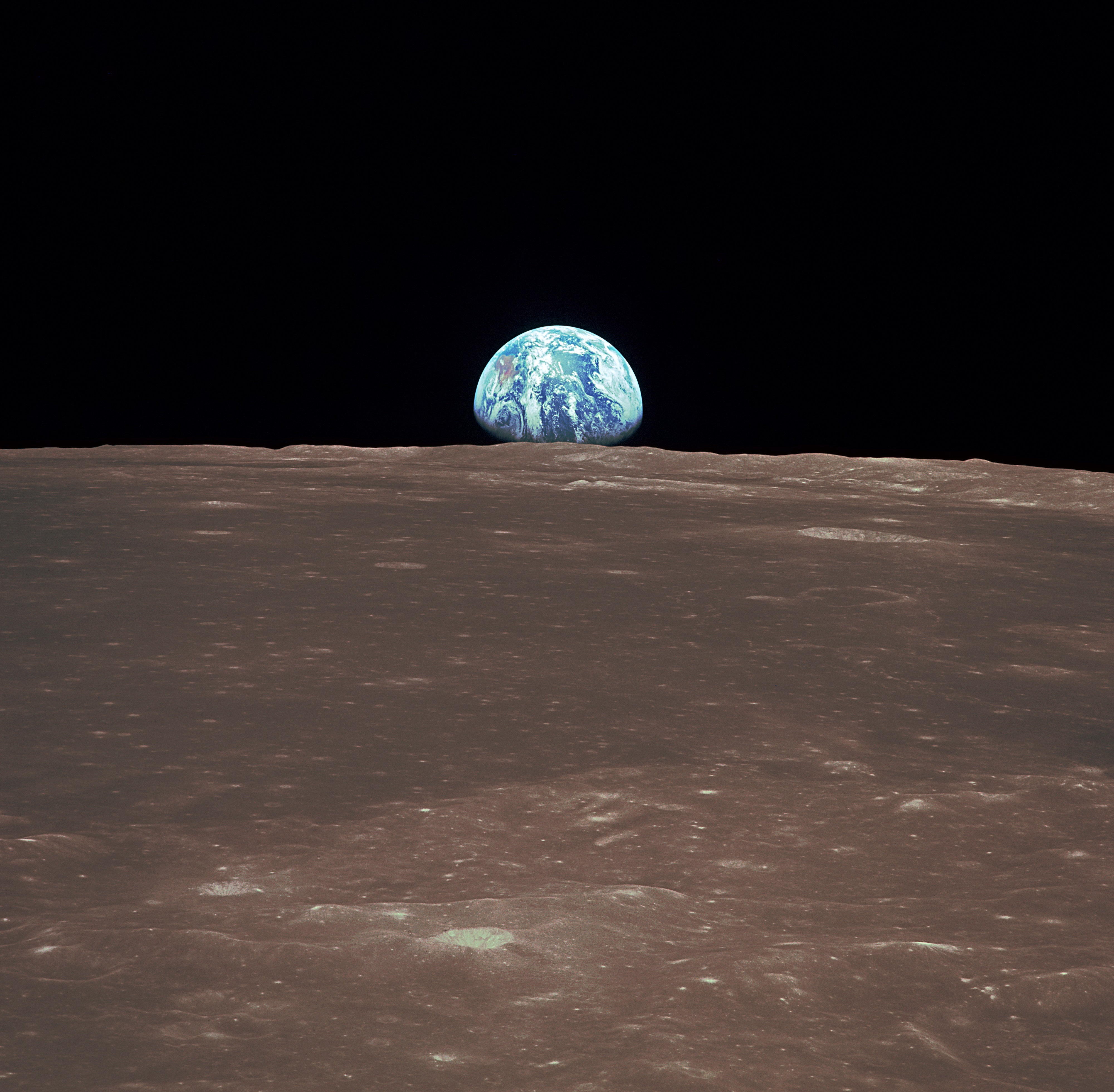 File:View from the Apollo 11 shows Earth rising above the moon's ...