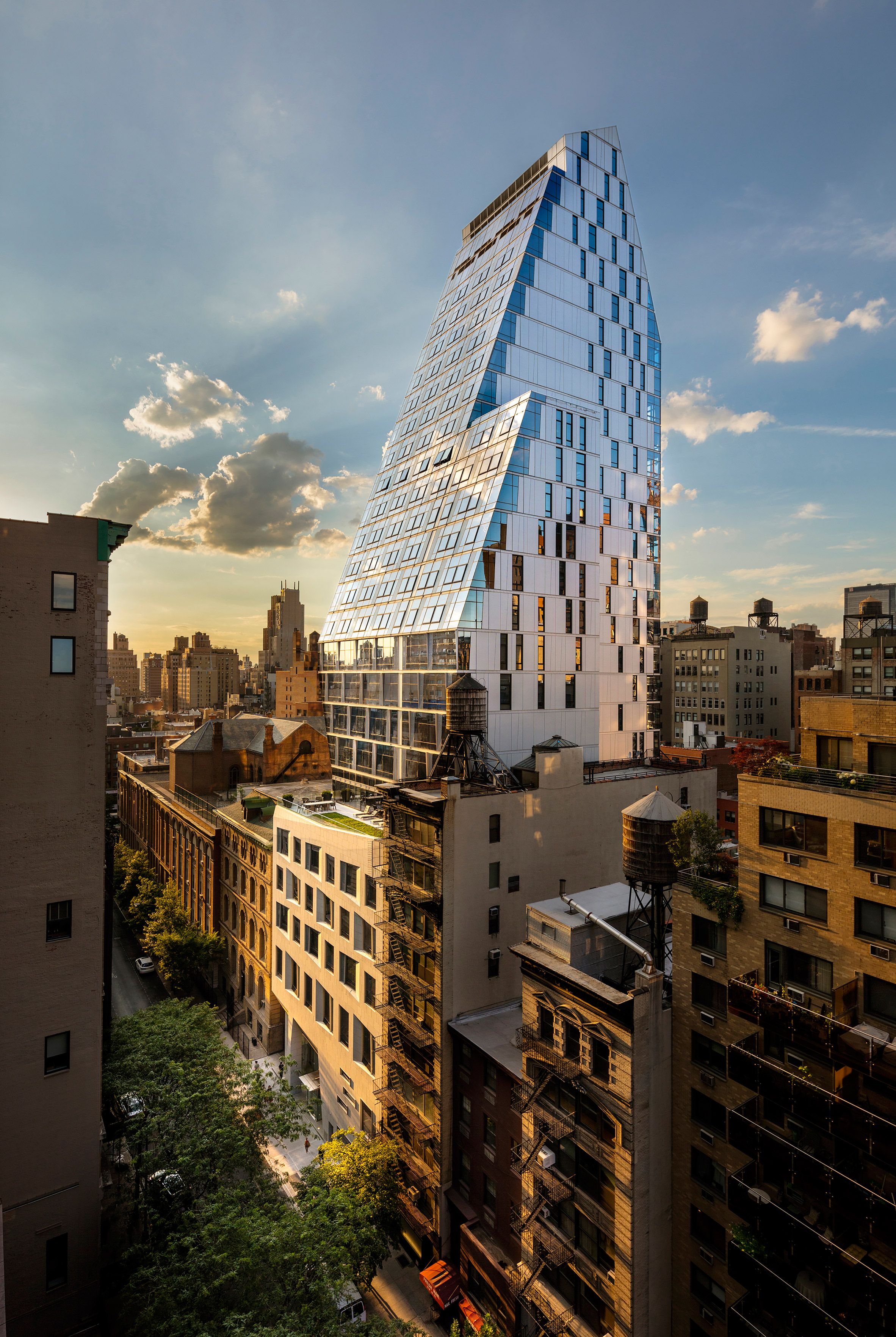Giant slanted glass wall defines New York apartment tower by FXFOWLE ...