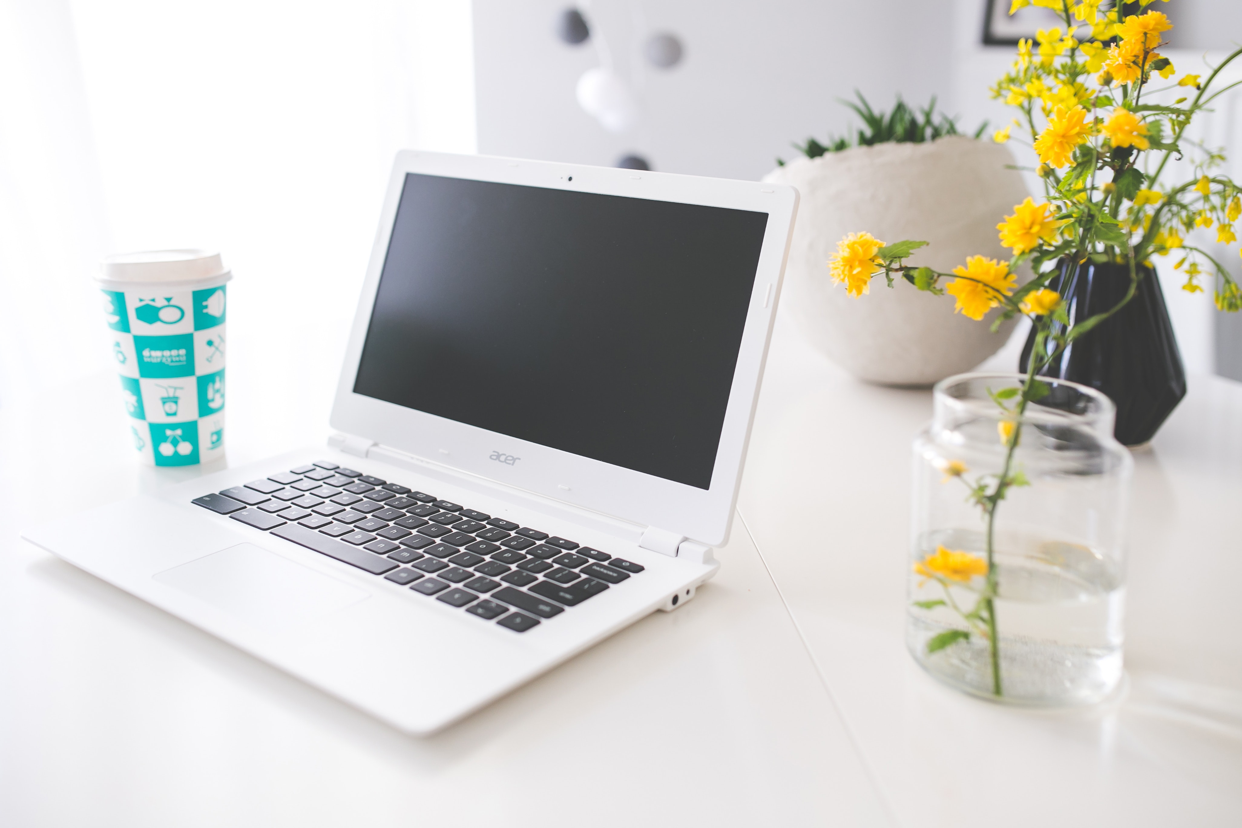 Acer chromebook on the white desk photo