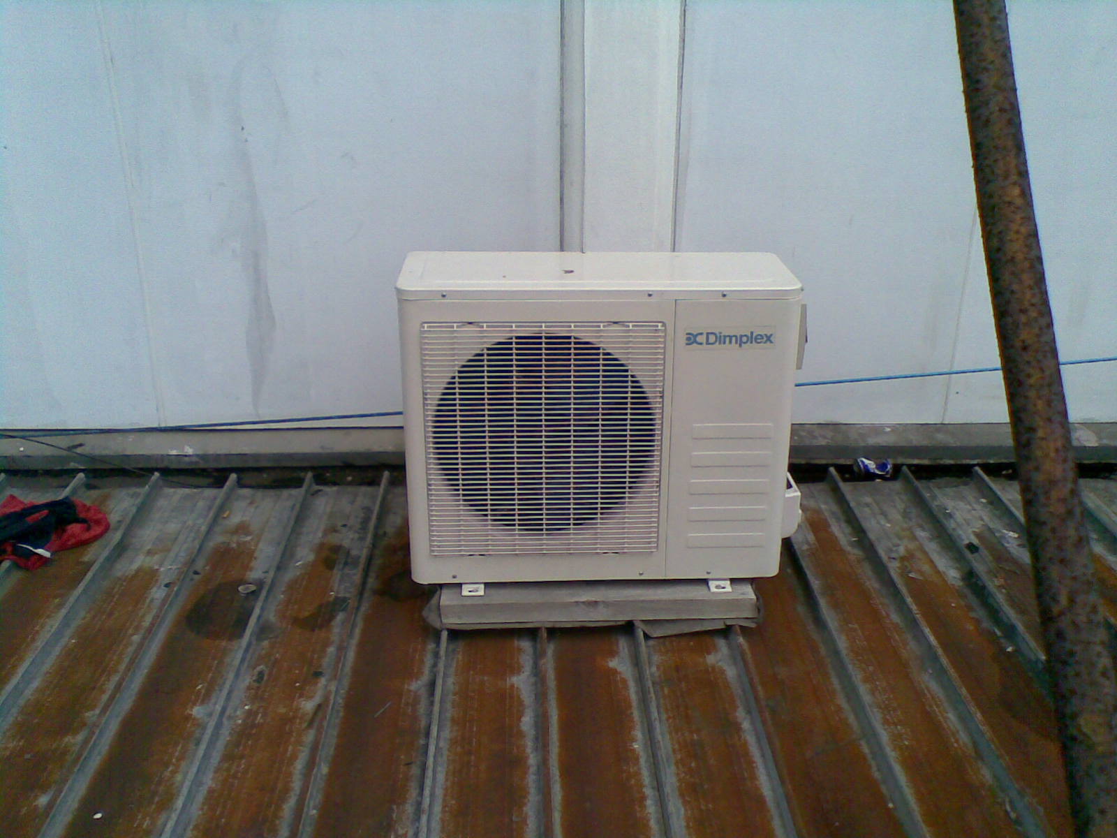 Air conditioner on rusted roof photo