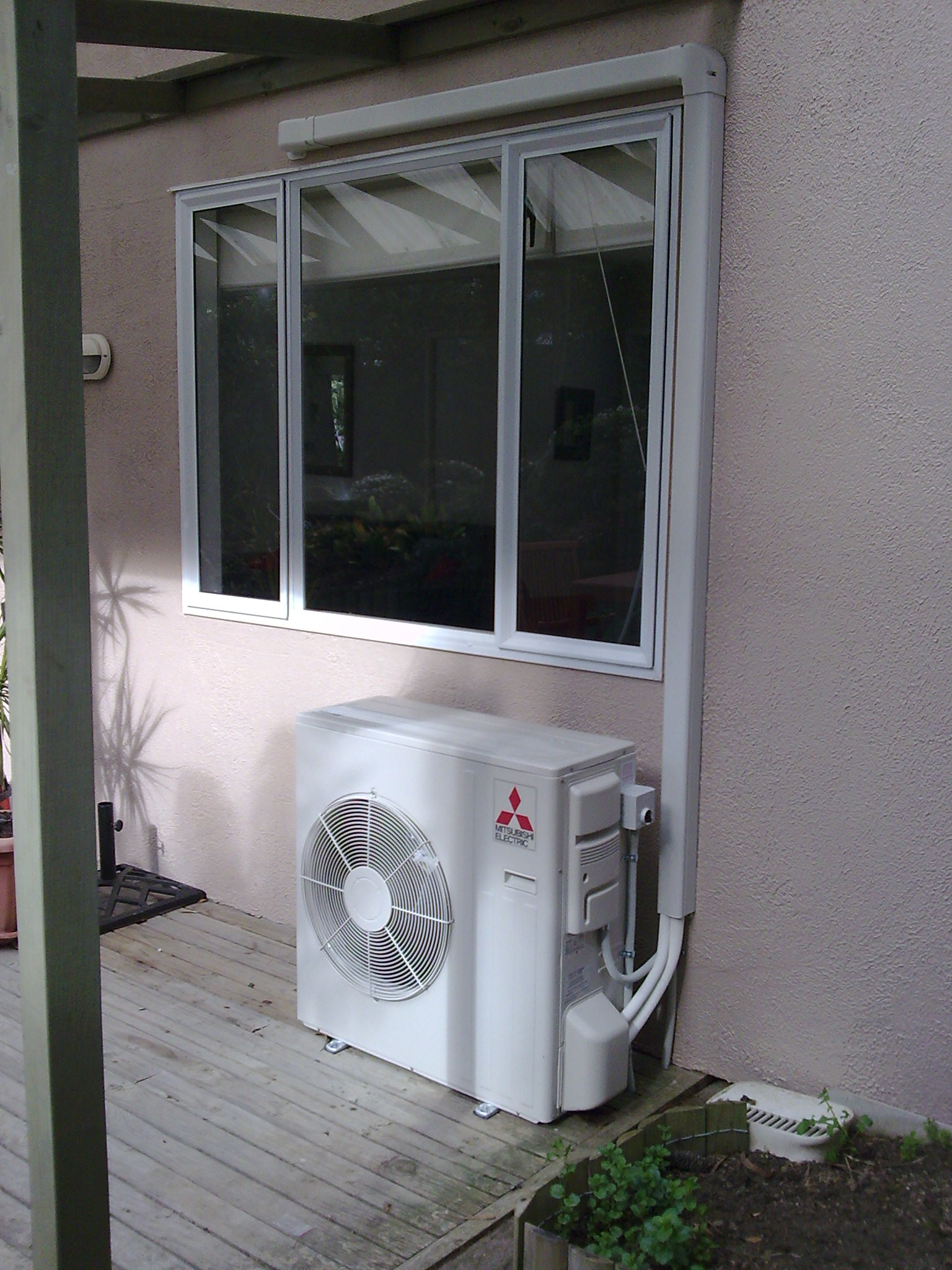 Air conditioner under window photo