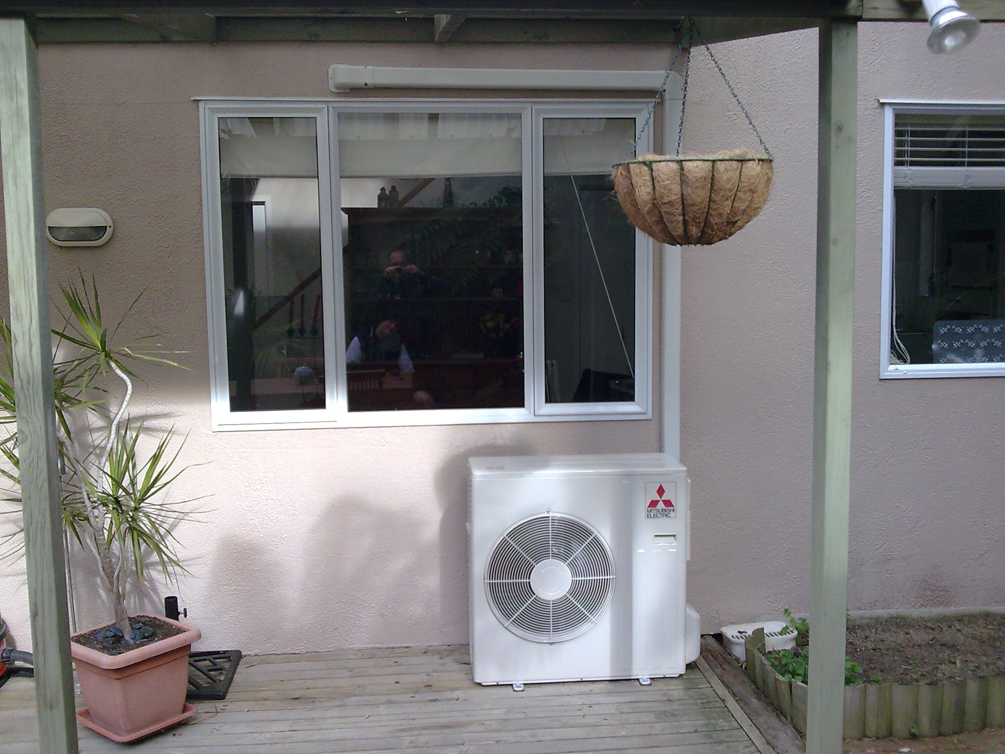 Air conditioner under window photo