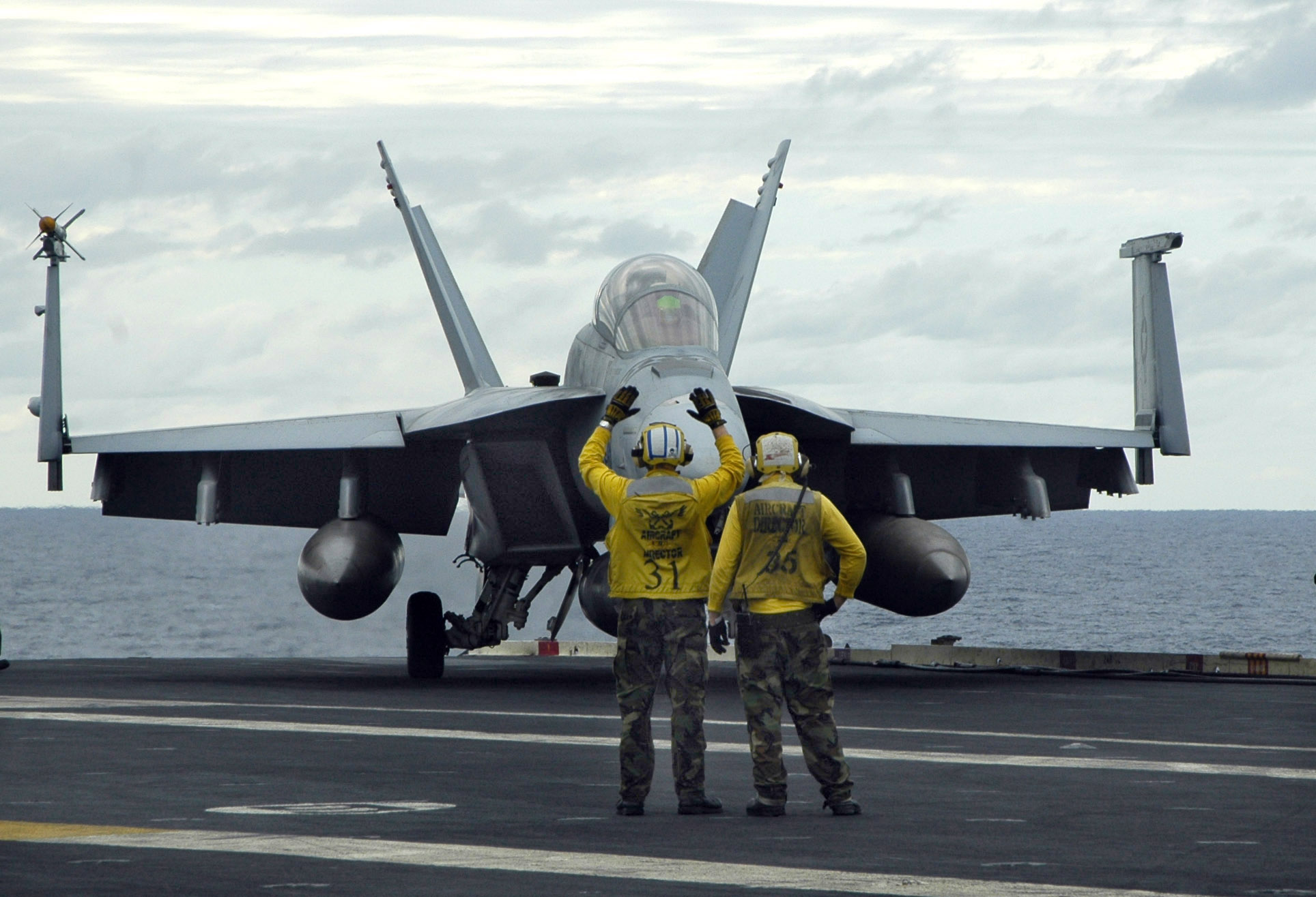 File:US Navy 050622-N-8604L-065 Aircraft directors signal for an F-A ...