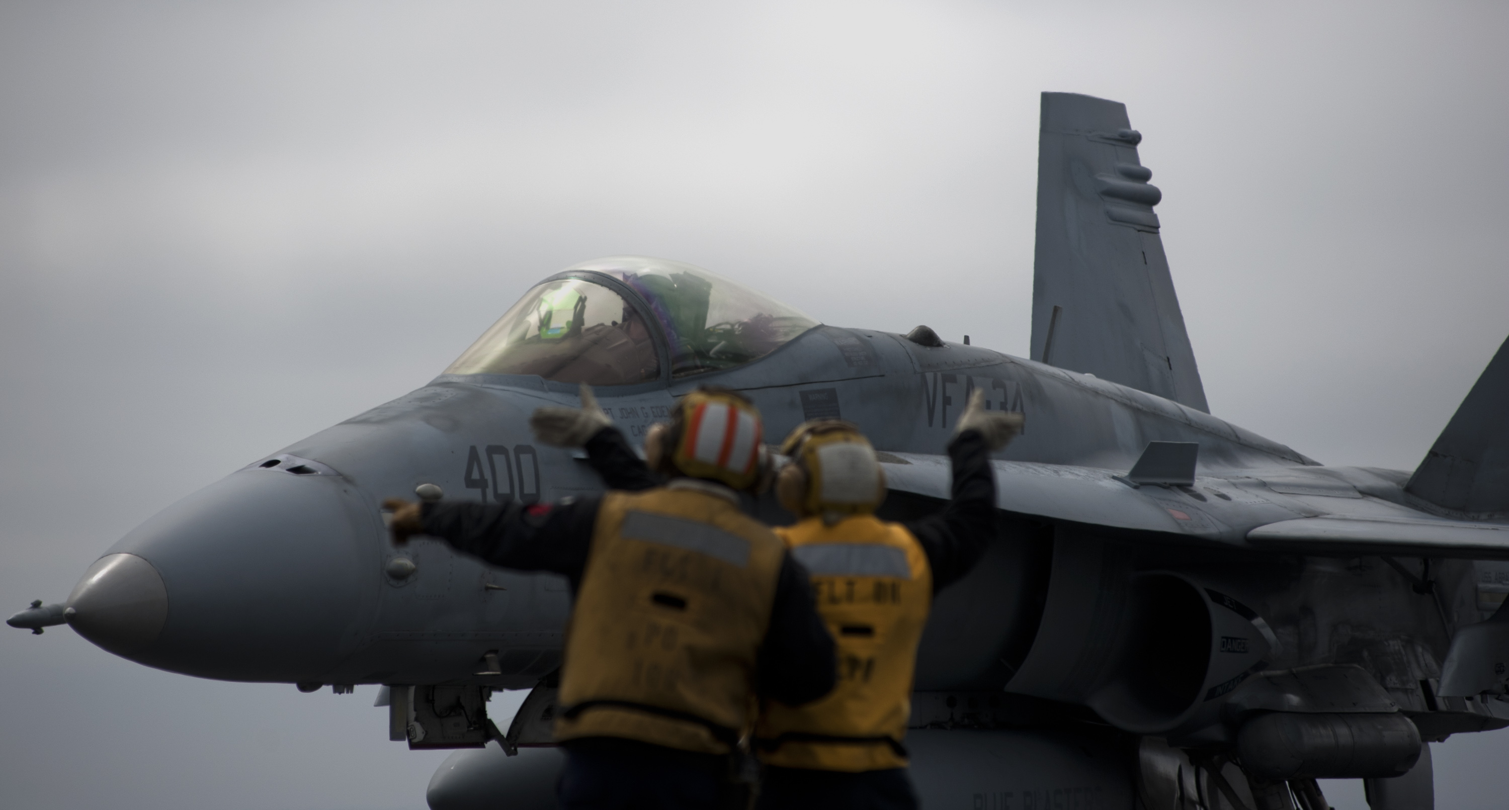 File:US Navy 110922-N-TU221-477 Aircraft directors guide an F-A-18C ...