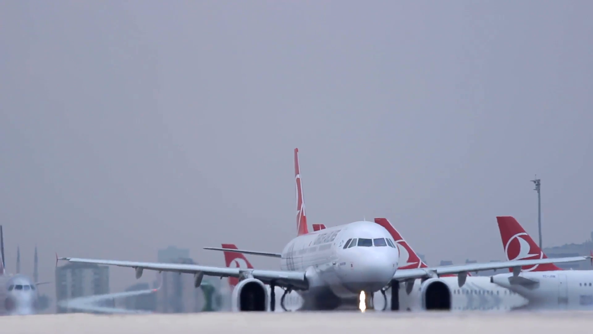 Airplanes line-up on a runway waiting to take off - Istanbul Ataturk ...