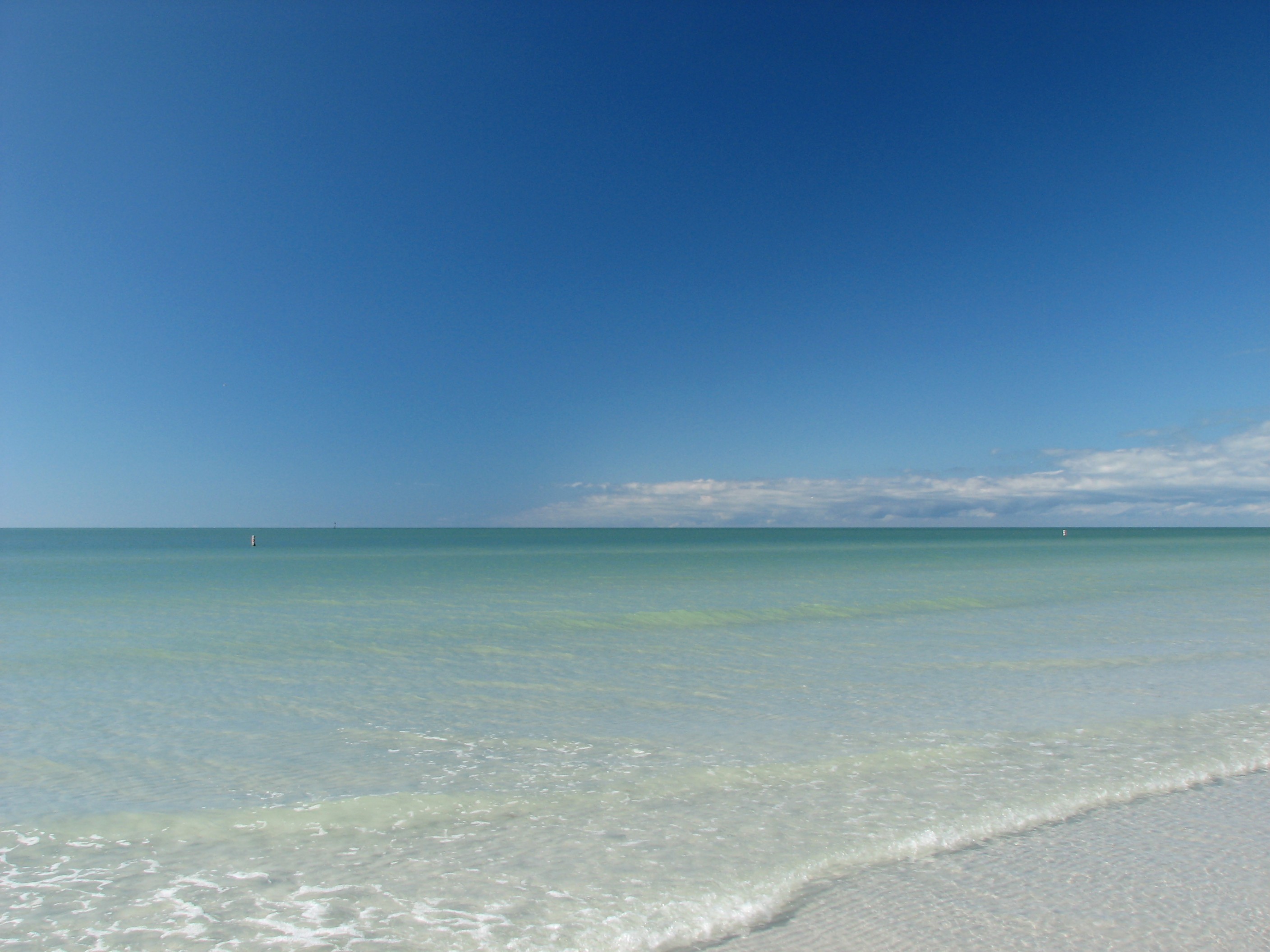 An ocean and beach landscape photo