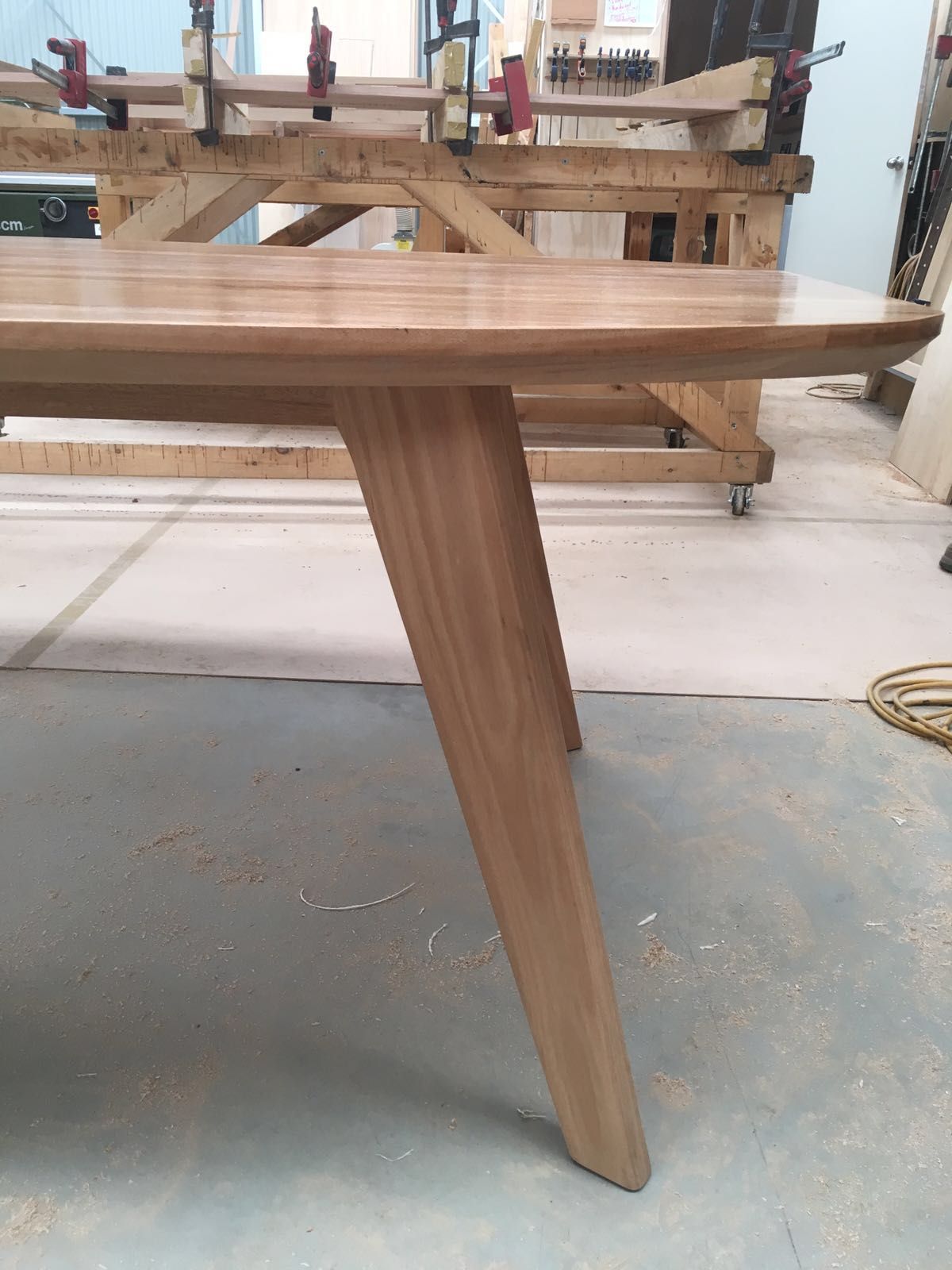 Angled and tapered leg dining table made from beautiful blackbutt ...