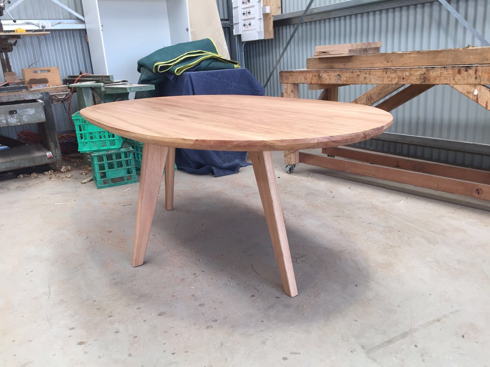Custom oval dining table made from Blackbutt timber. Tapered angled ...