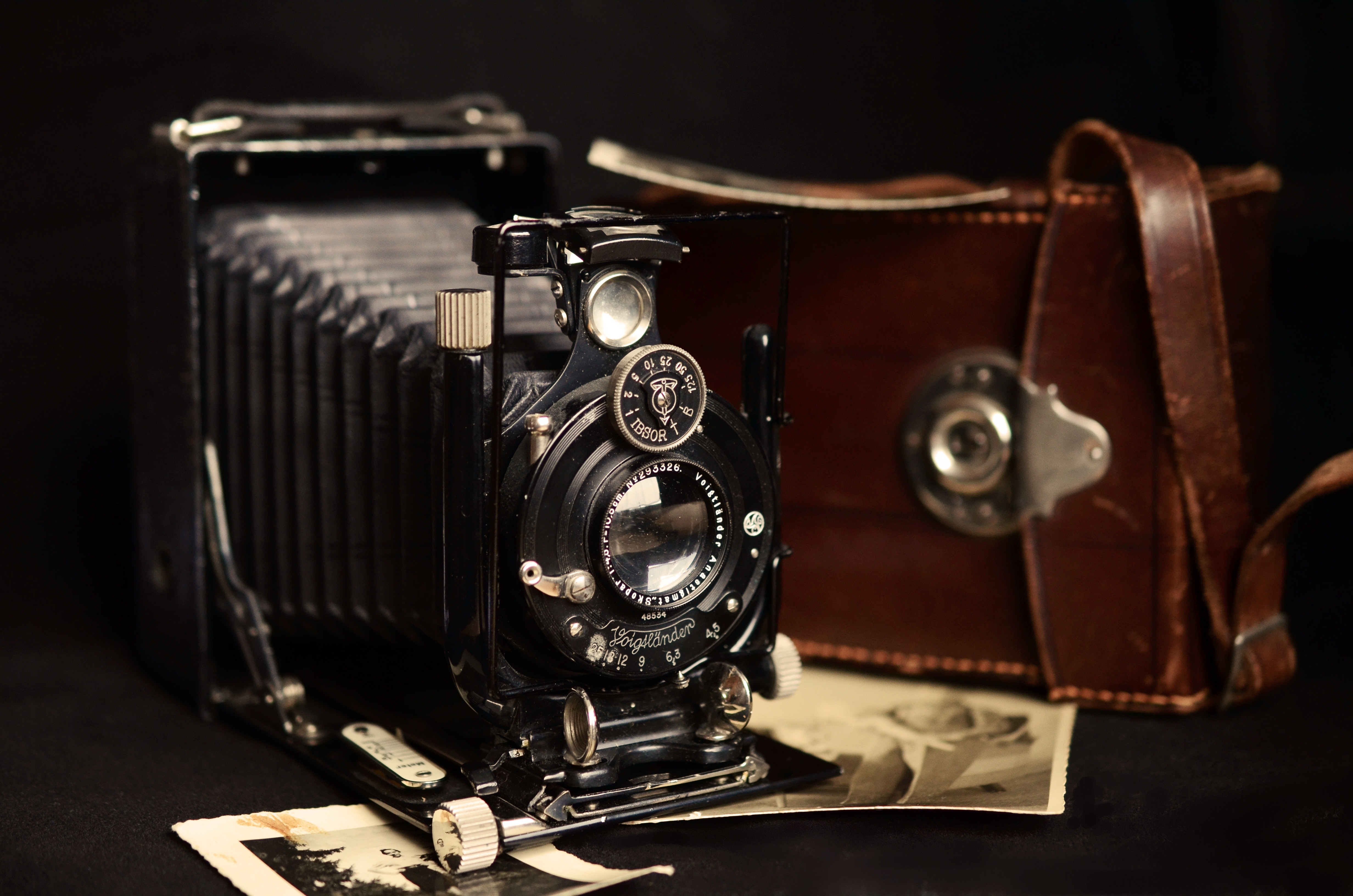 Black Classic Camera Near Brown Leather Bag · Free Stock Photo