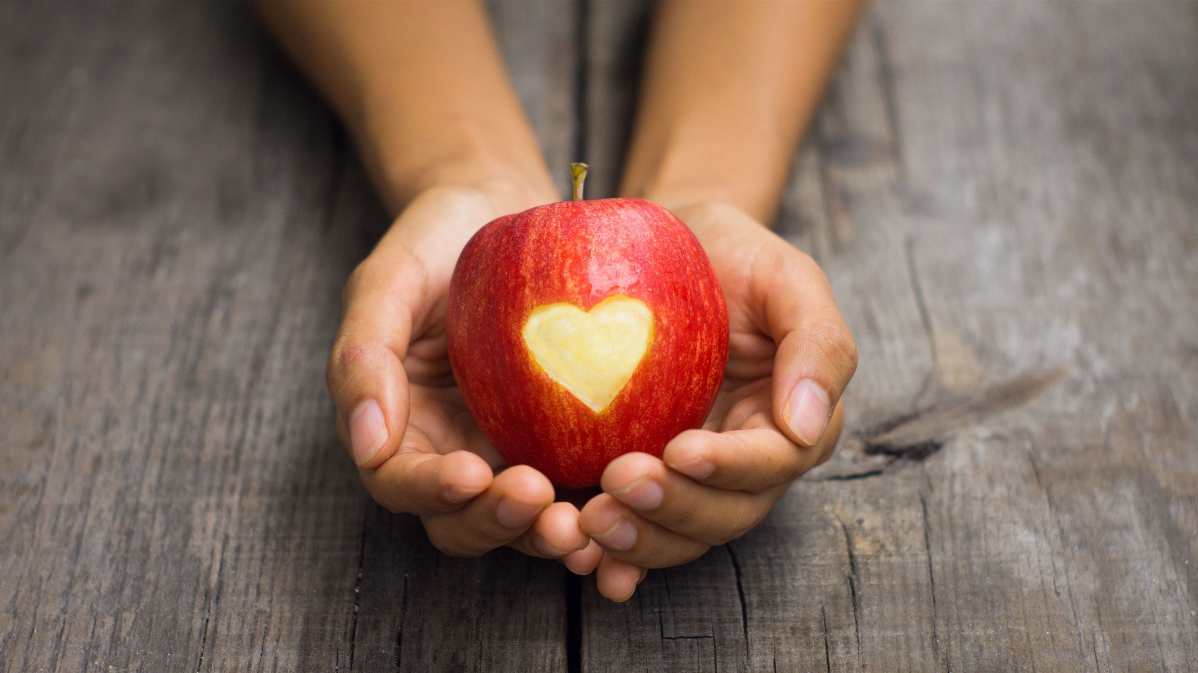 Red apple in hand, love heart shaped wallpaper | love | Wallpaper Better
