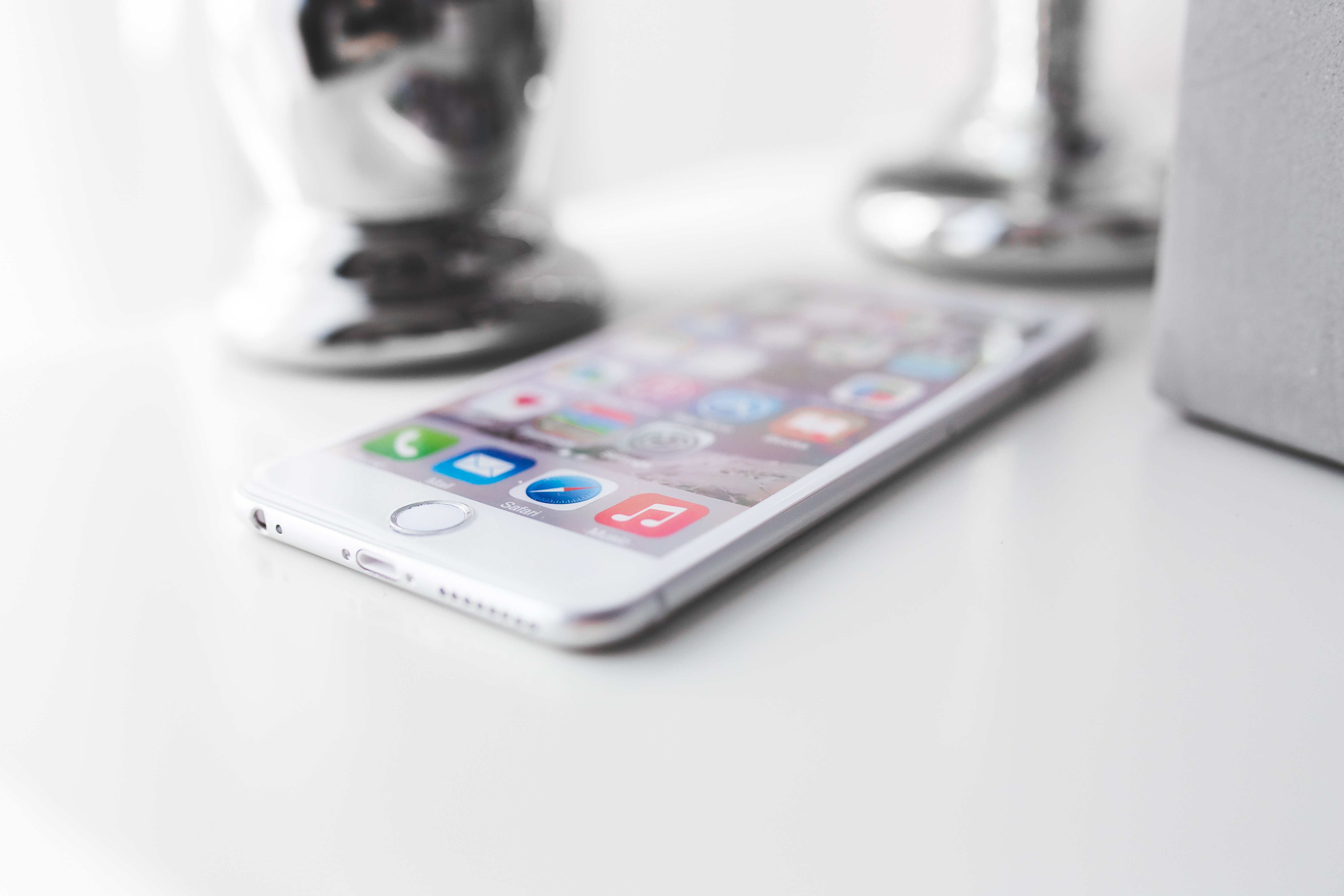 Apple iphone 6 plus on a white desk photo