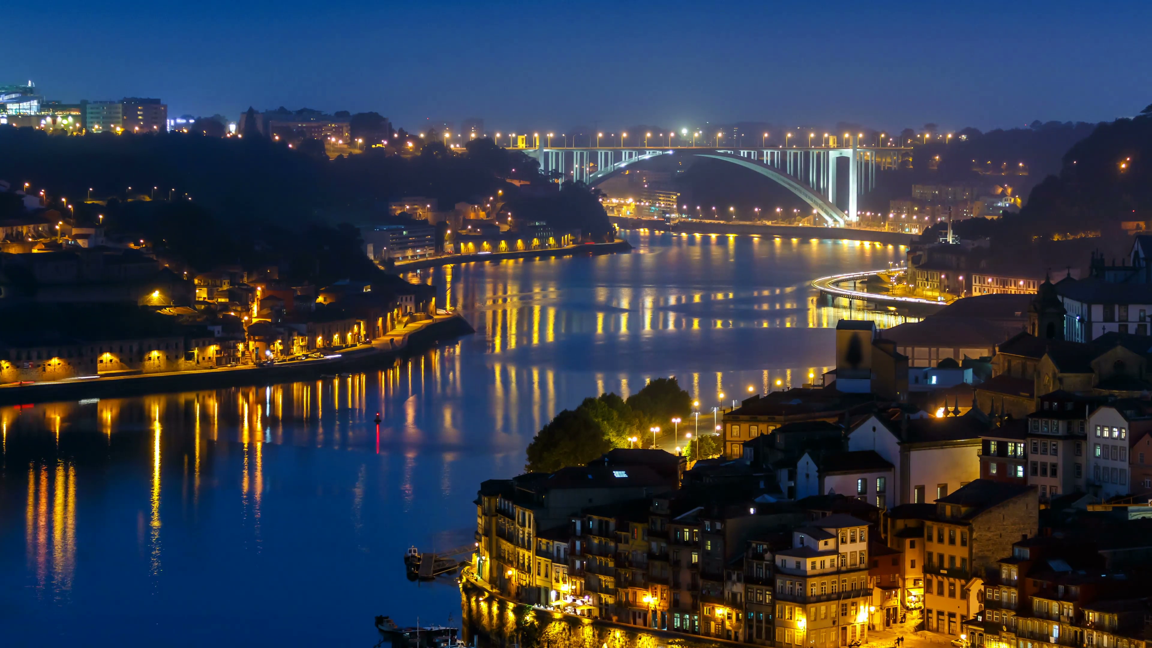City of Porto and Gaia from evening to night by the Douro river ...