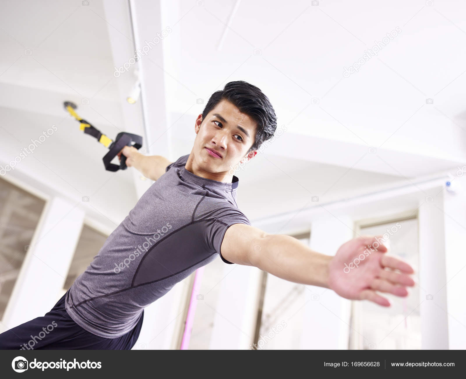 young asian adult working out in gym — Stock Photo © imtmphoto ...
