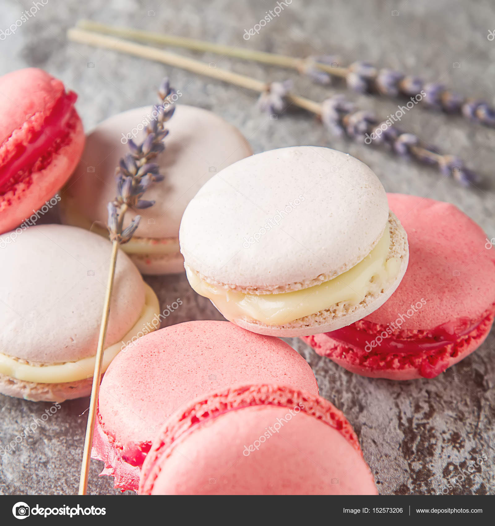 Traditional French sweets. Assorted pink, white macaroon with dr ...