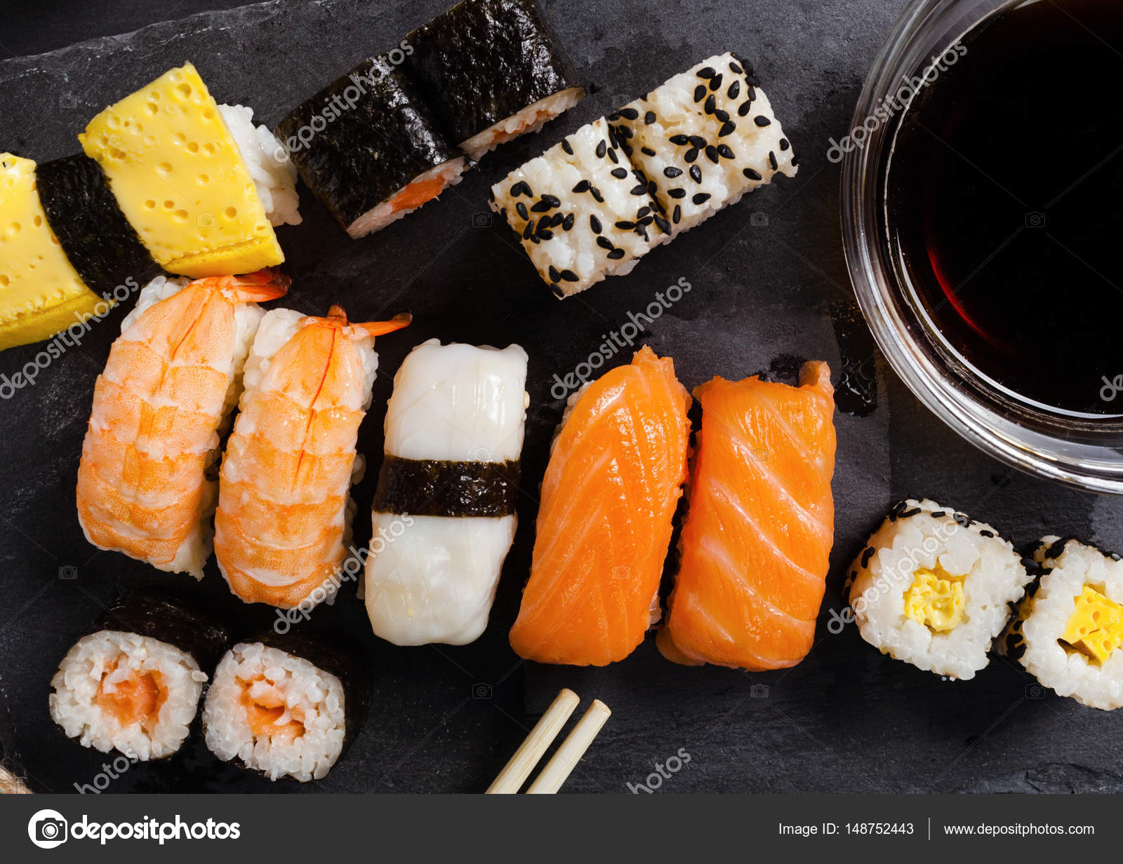 Slate tray of assorted sushi — Stock Photo © AntonioGravante #148752443