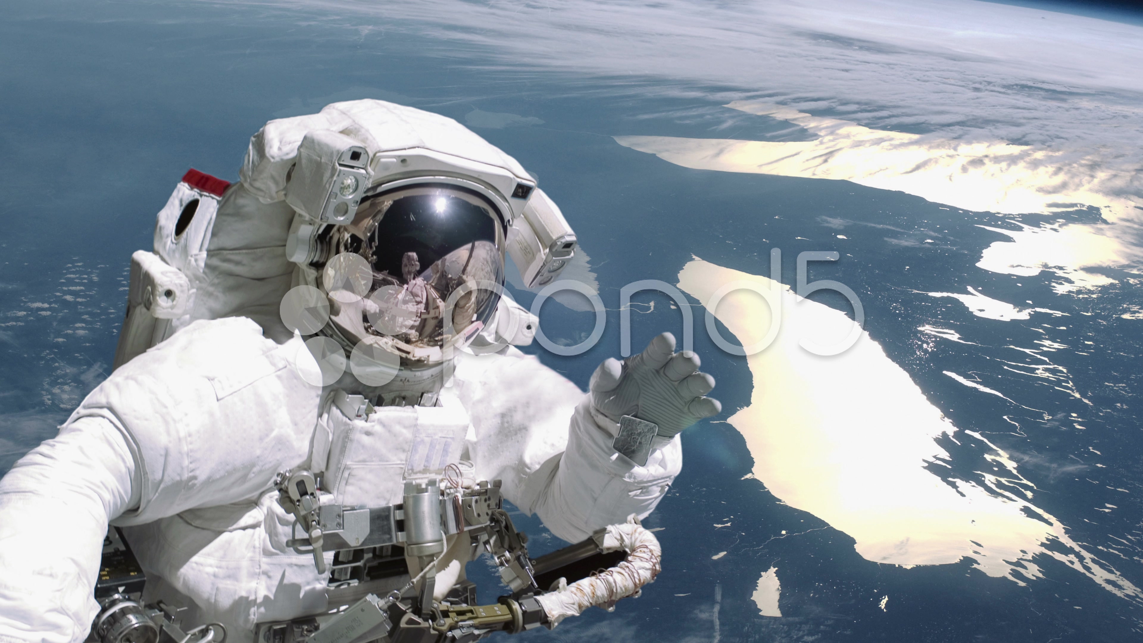 Astronaut waves in deep space - 4K ~ Hi Res Video #37585216