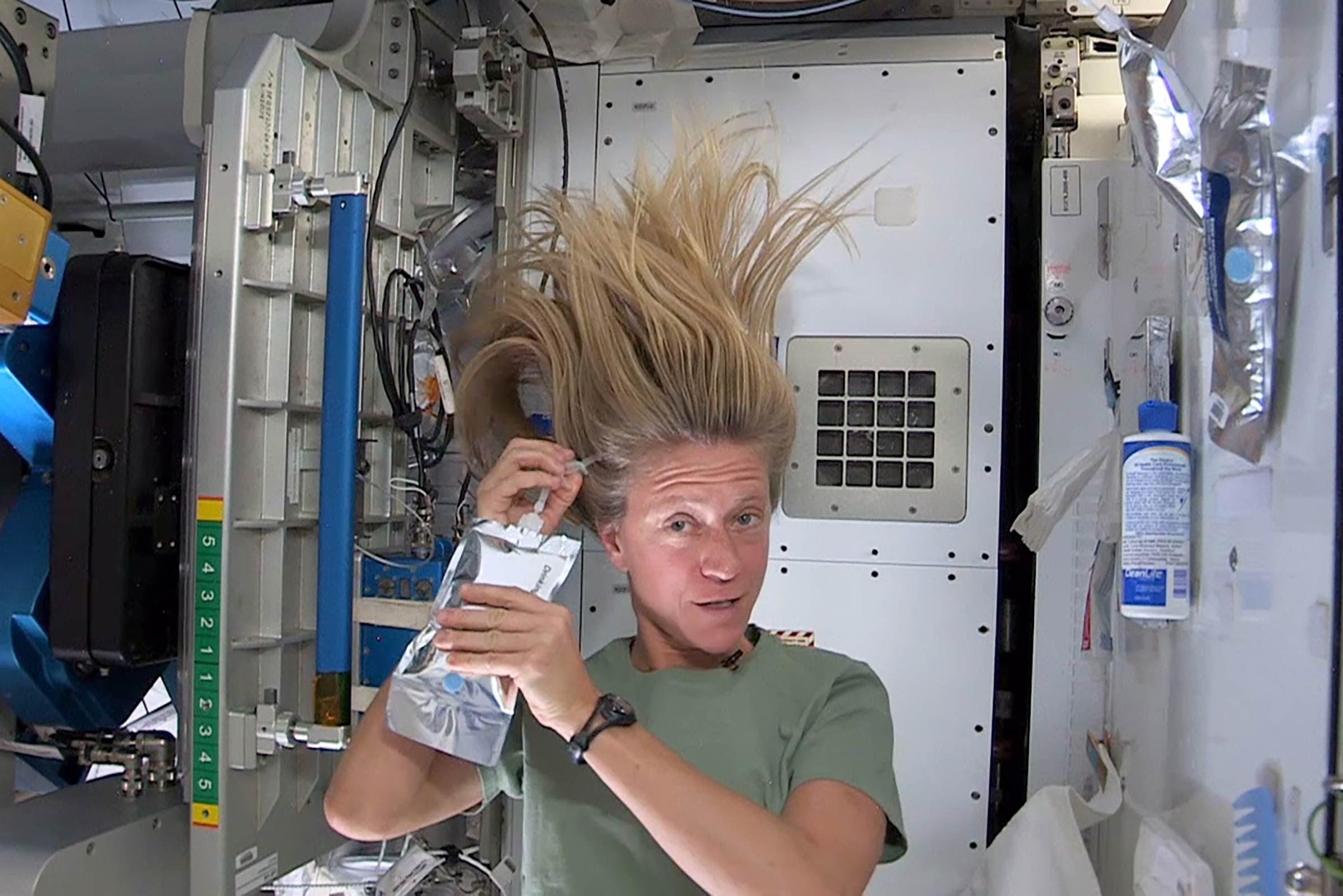 Astronaut washing hair photo