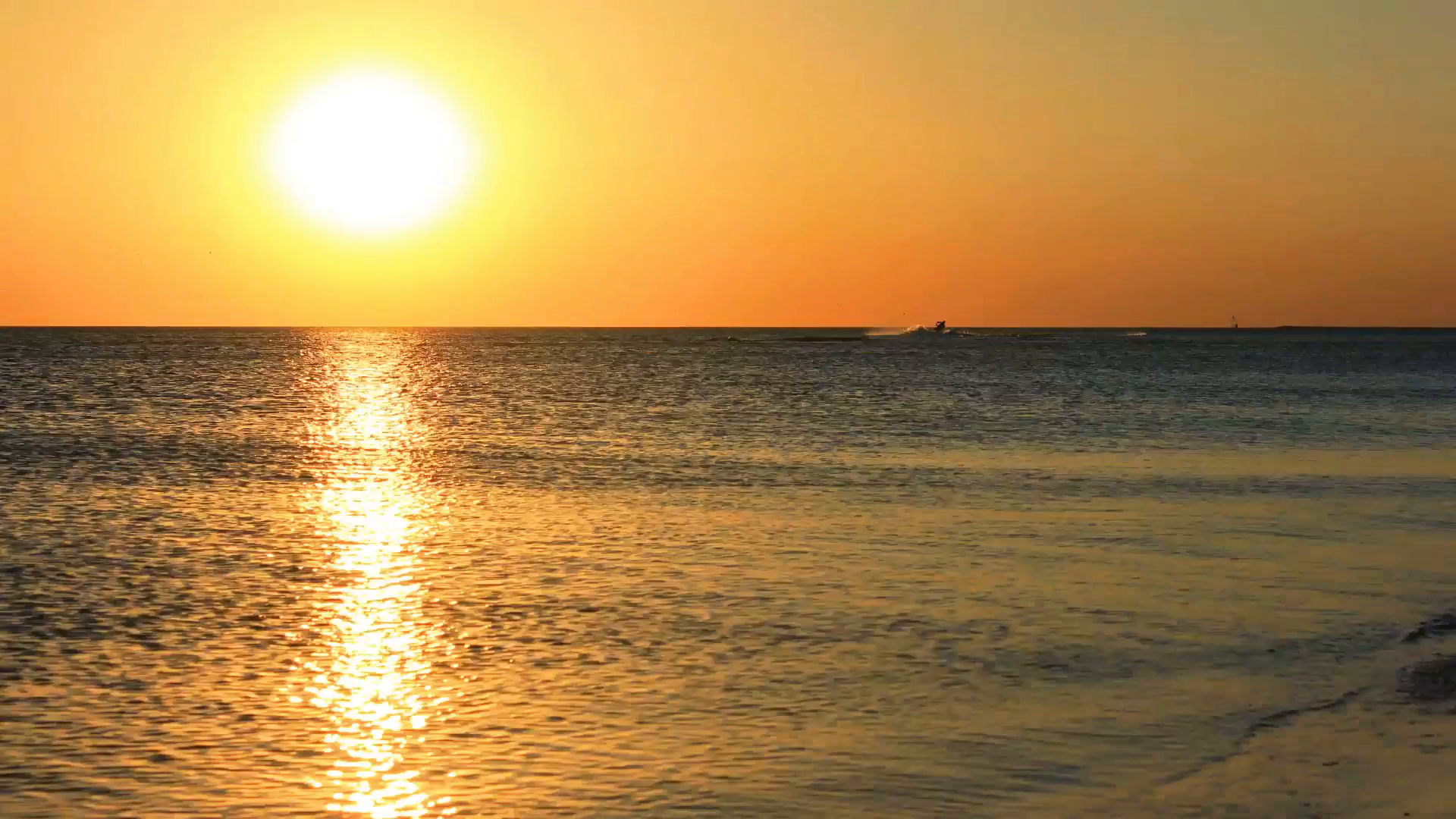 Fast sea sunset time lapse. Sun sets behind sea horizon. Golden ...