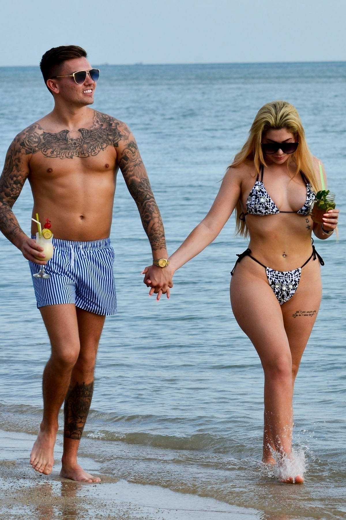 Chloe Ferry enjoys a walk in a bikini at the beach with Sam Gowland ...