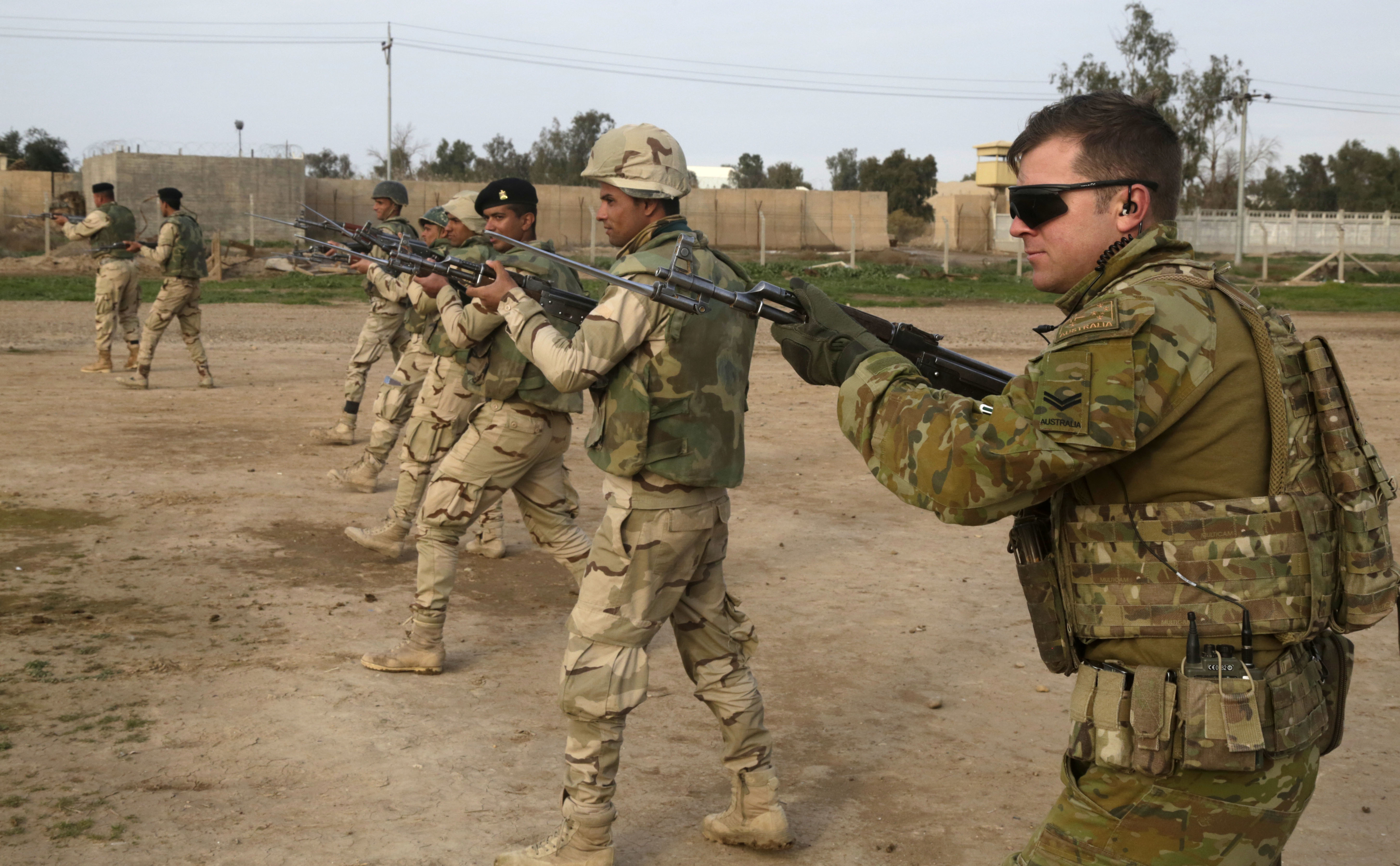 File:An Australian soldier, assigned to Task Group Taji, conducts ...