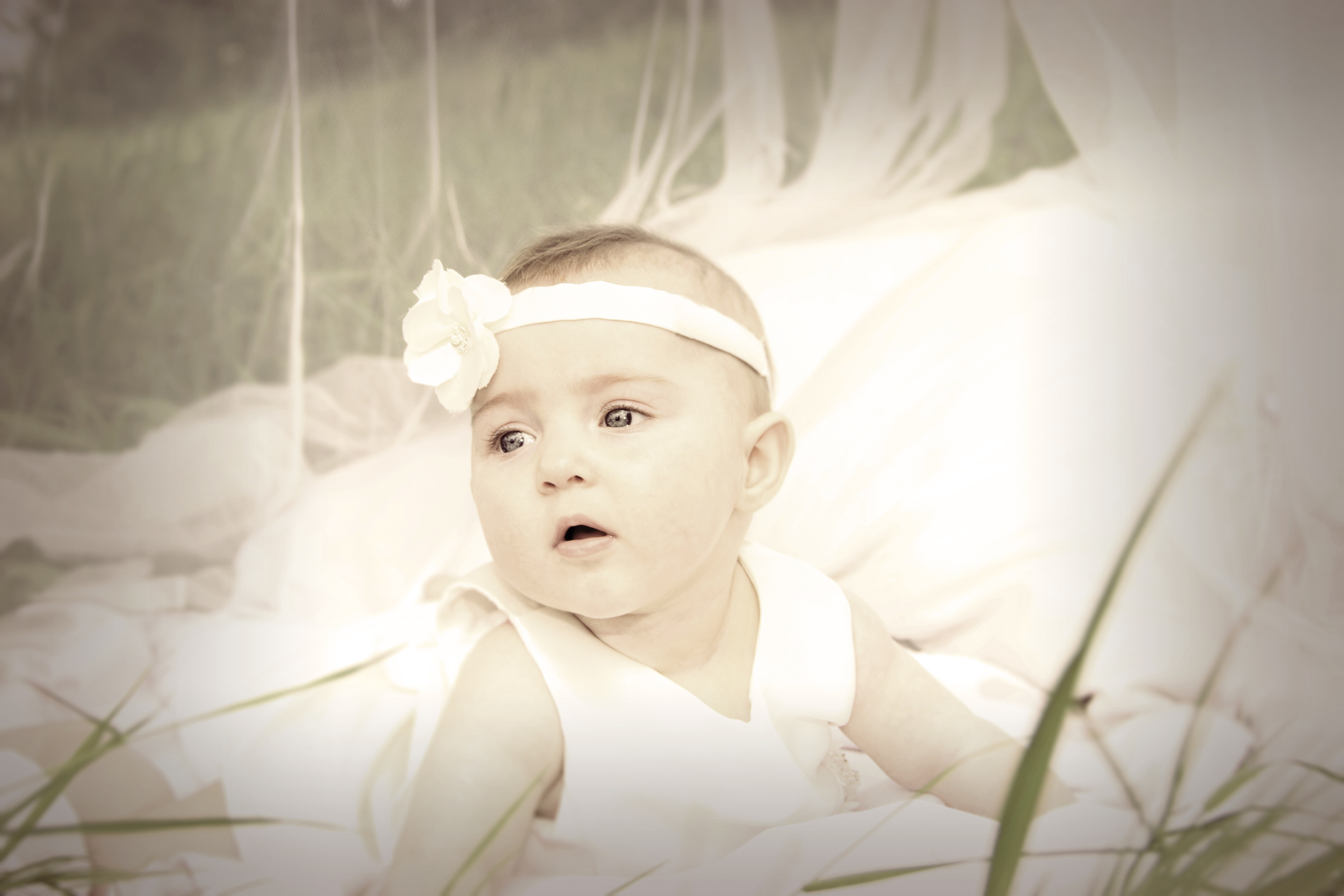 Baby in white tank dress and headband photo