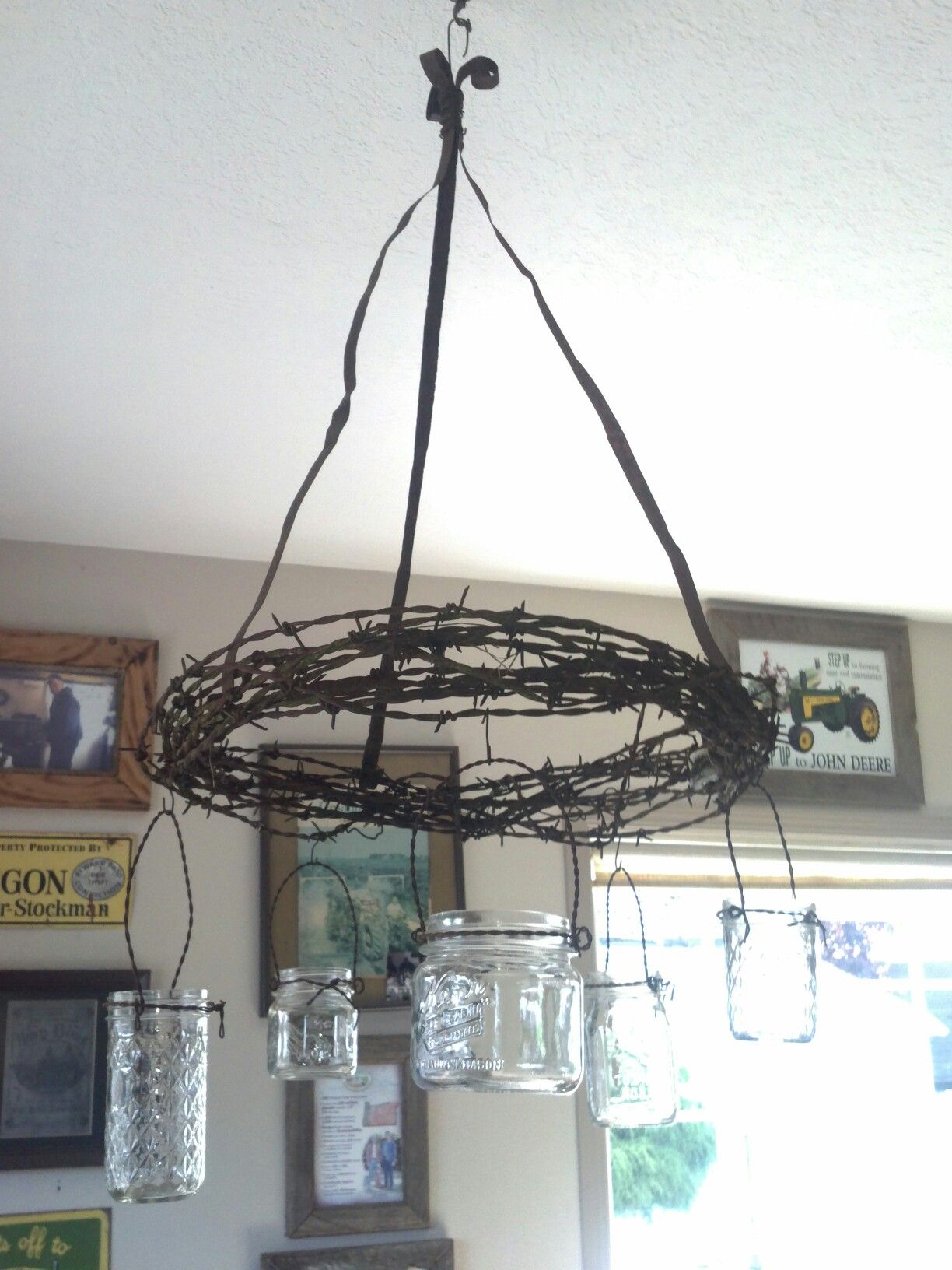 Barbed wire & mason jar chandelier- this would be soooo cute hanging ...