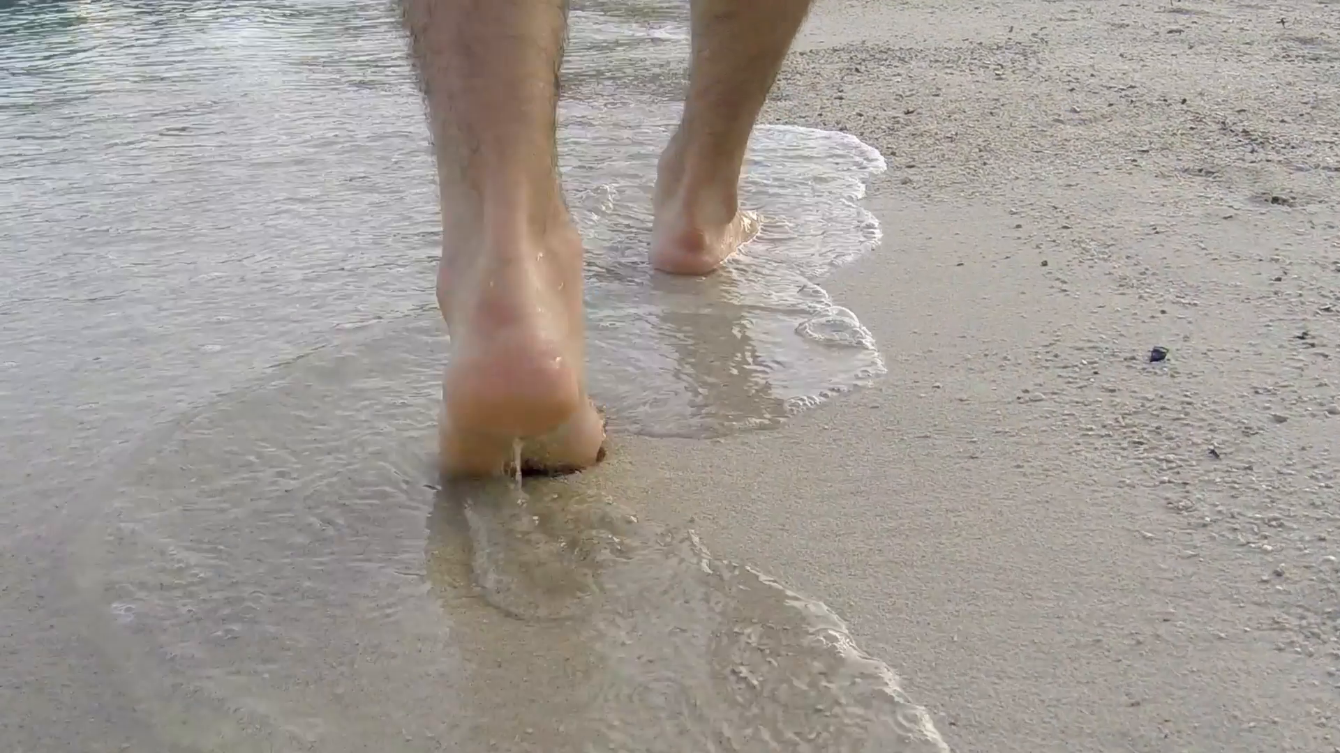 Men walking barefoot on wet sand island beach, Stock Video Footage ...