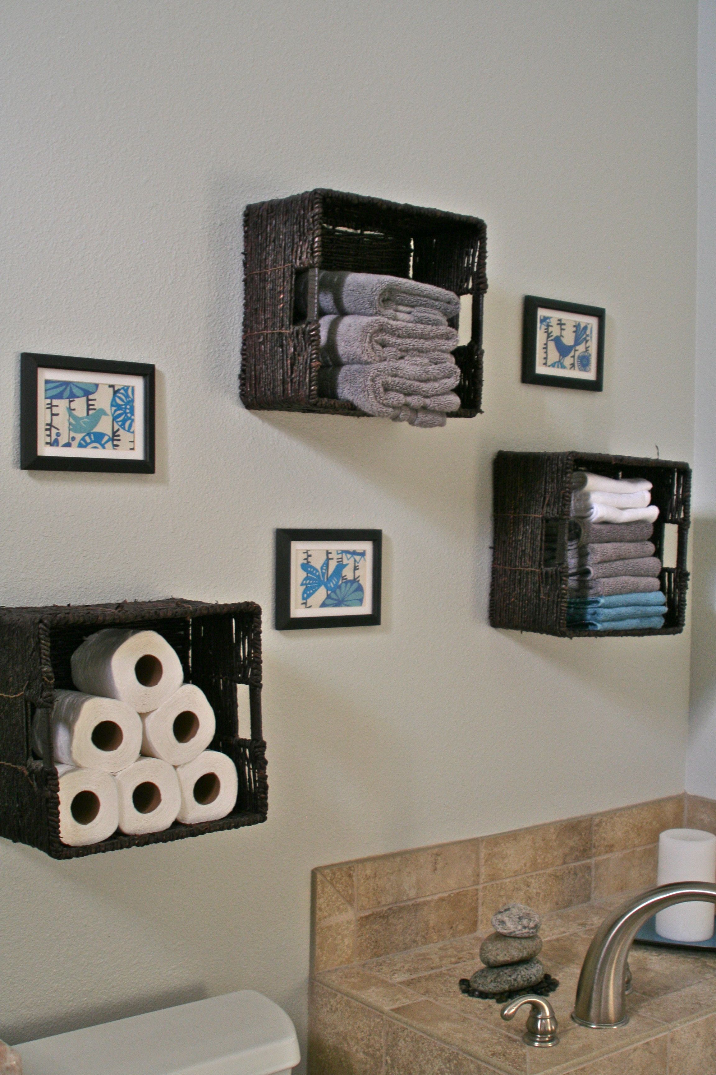 Bathroom storage - baskets for towels, toilet paper etc Love the ...
