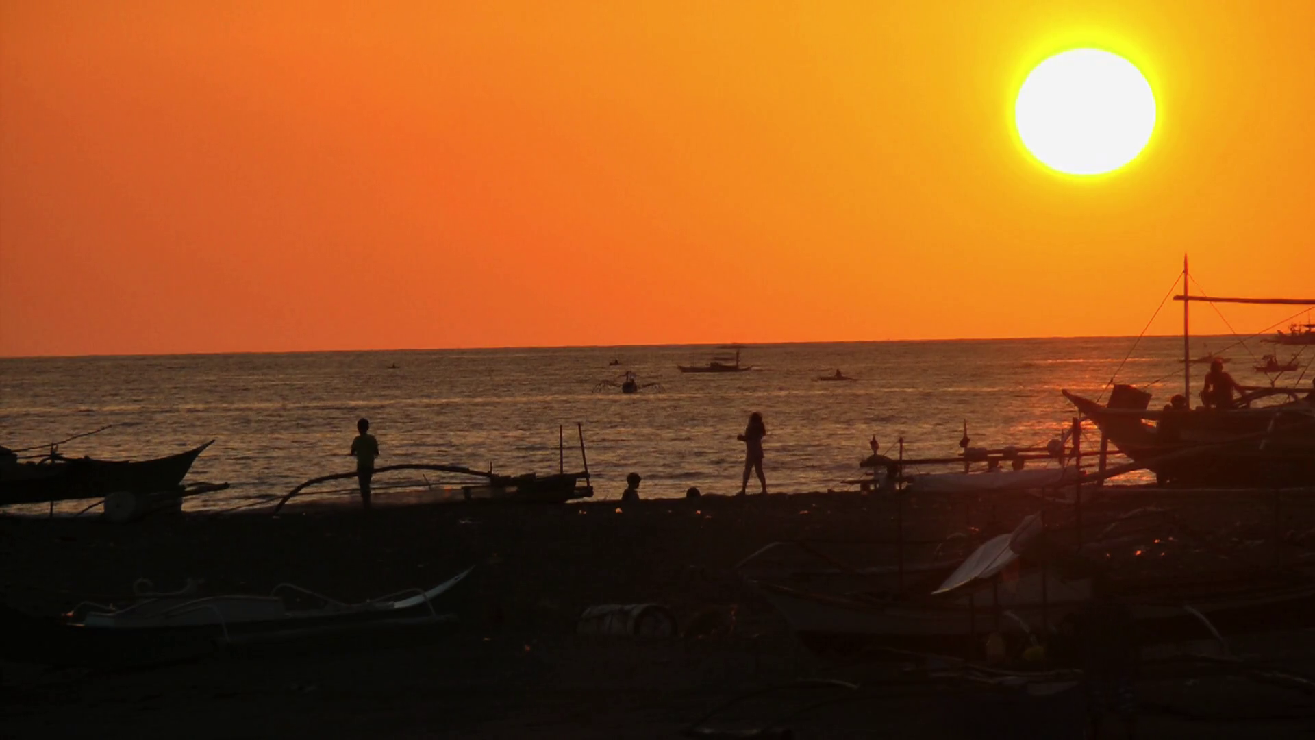 Time lapse of Children playing on Datu Sumakwel Beach during sunset ...