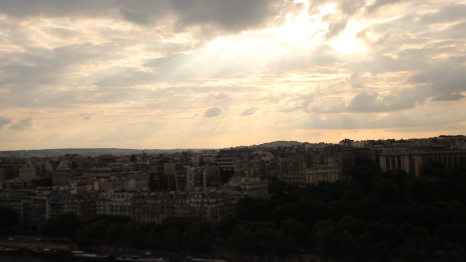 A beautiful sunset in Paris with light beaming through clouds | The ...