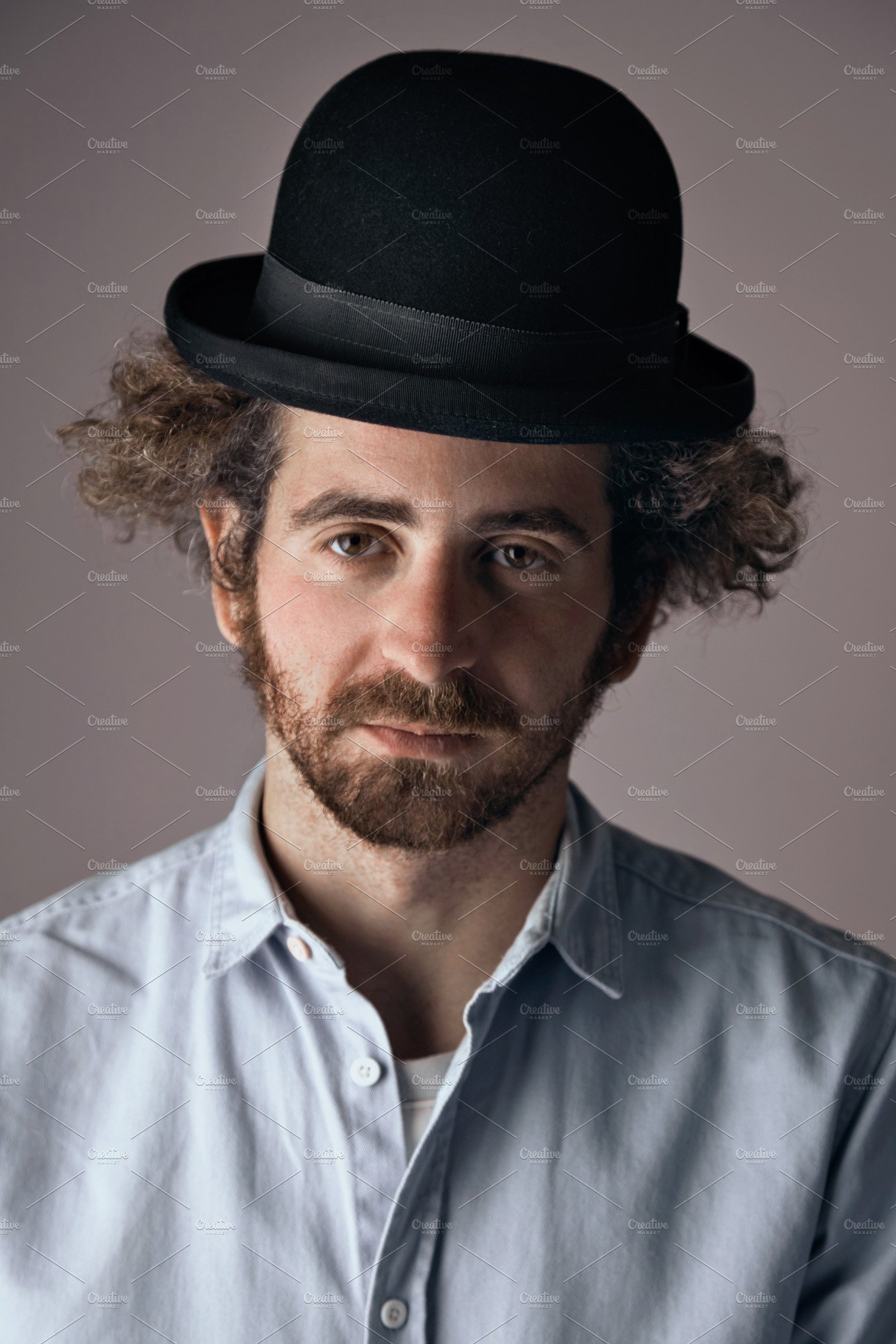 Sad bearded man with curly hair in black hat ~ People Photos ...