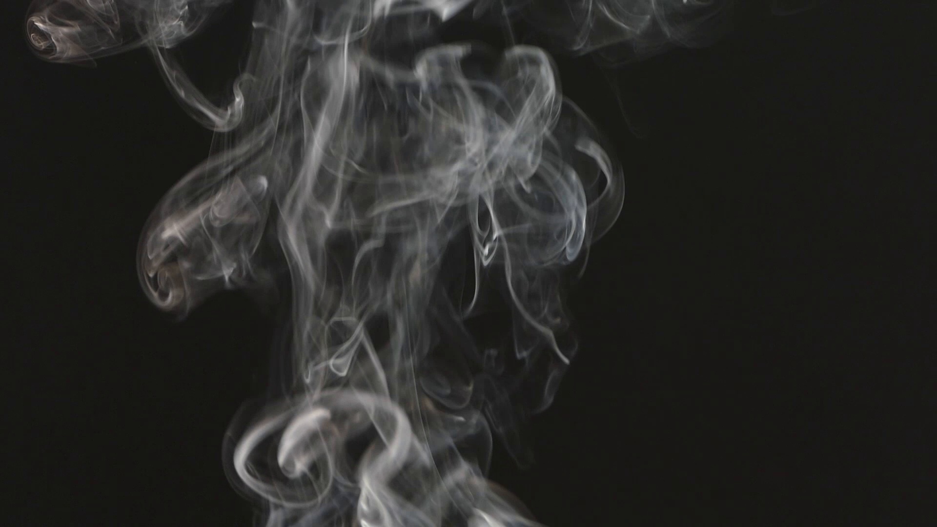 Video: Beautiful gray smoke on a black background. Cigarette smoke ...