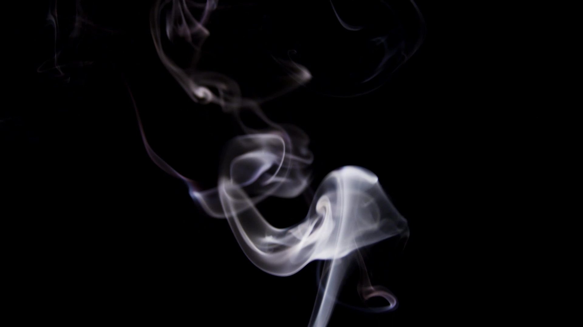 Beautiful spirals and swirls of thin lines of white smoke floating ...