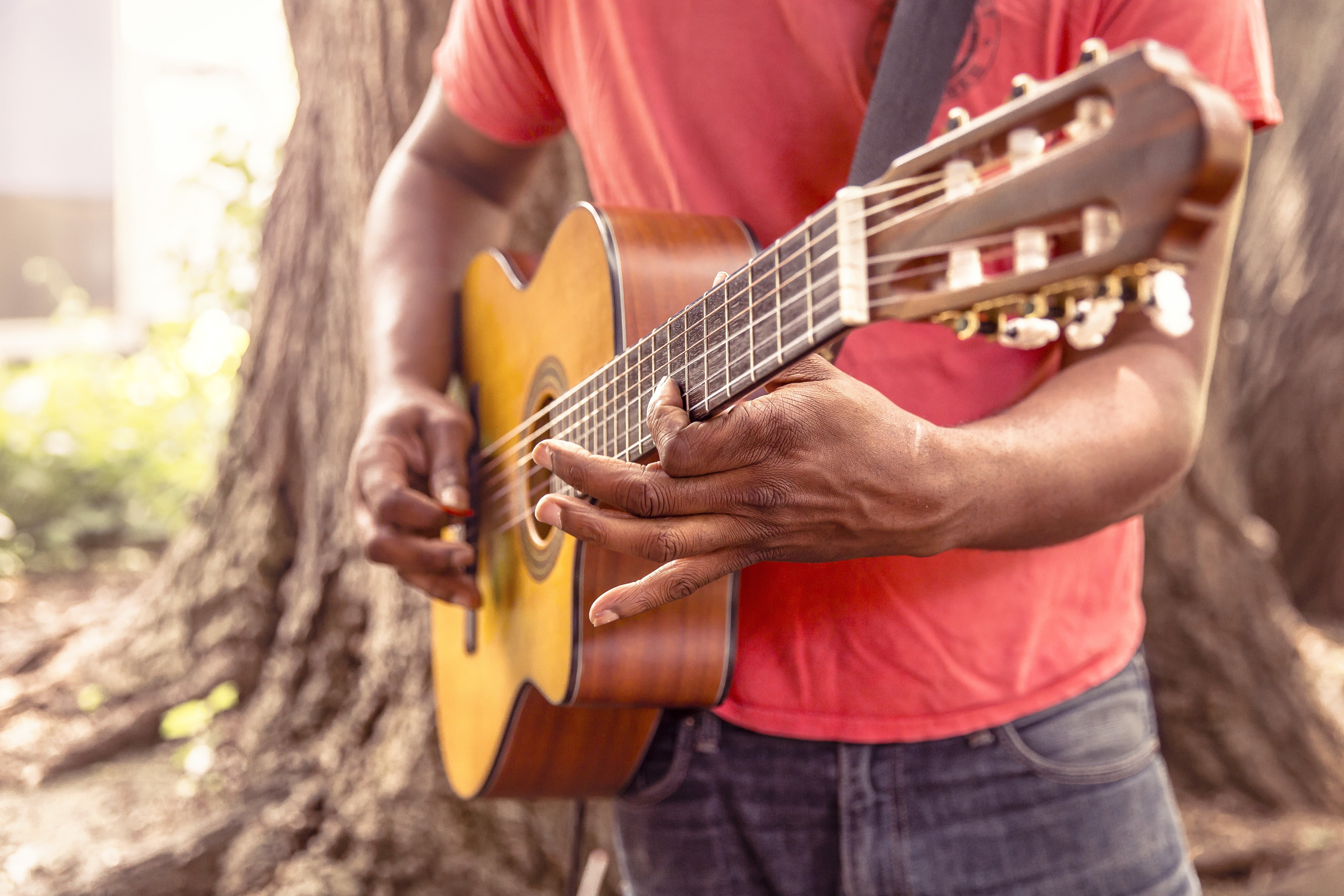 Photo of man playing beige classical guitar HD wallpaper | Wallpaper ...