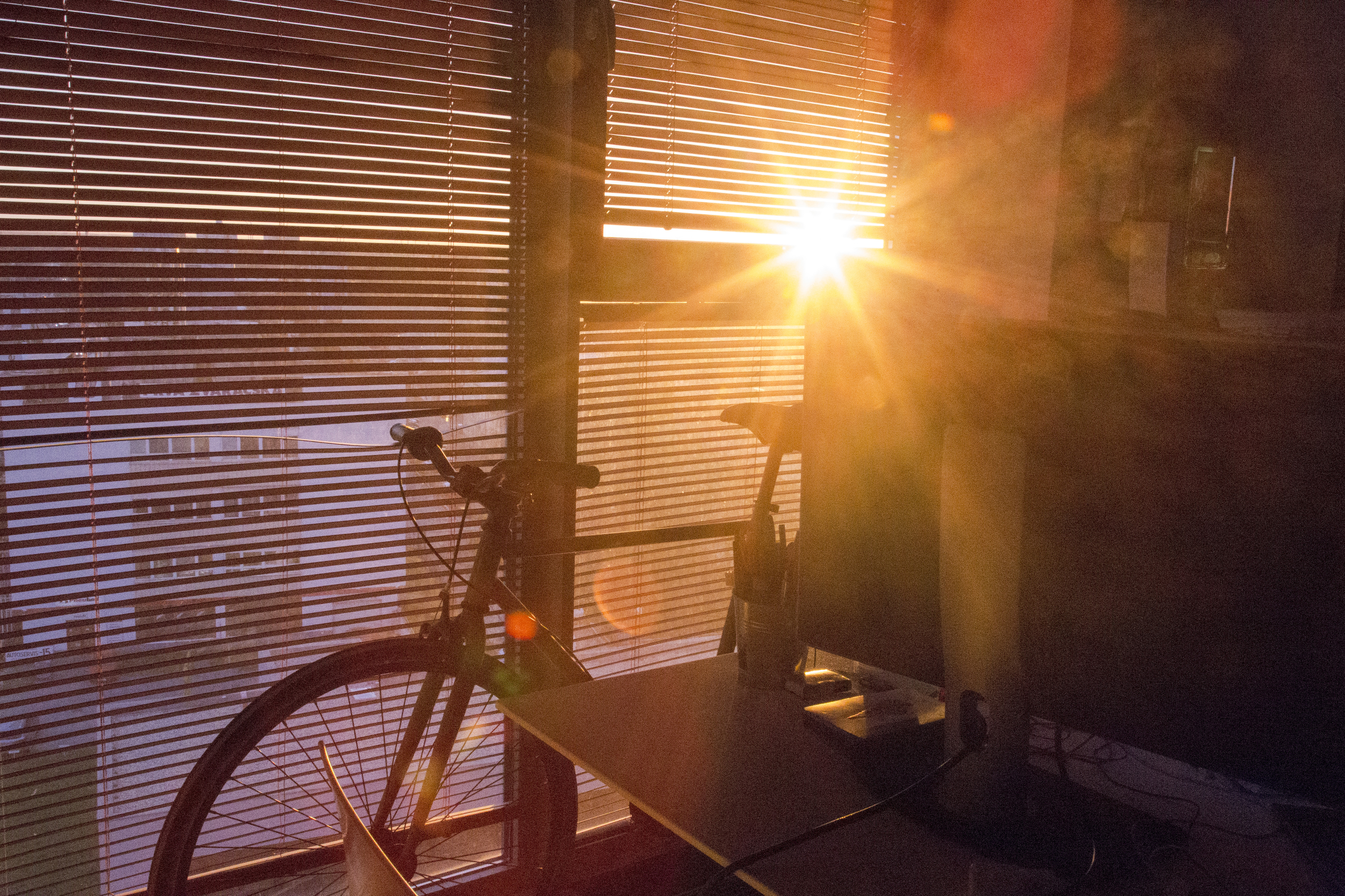 Bicycle and the sun setting photo