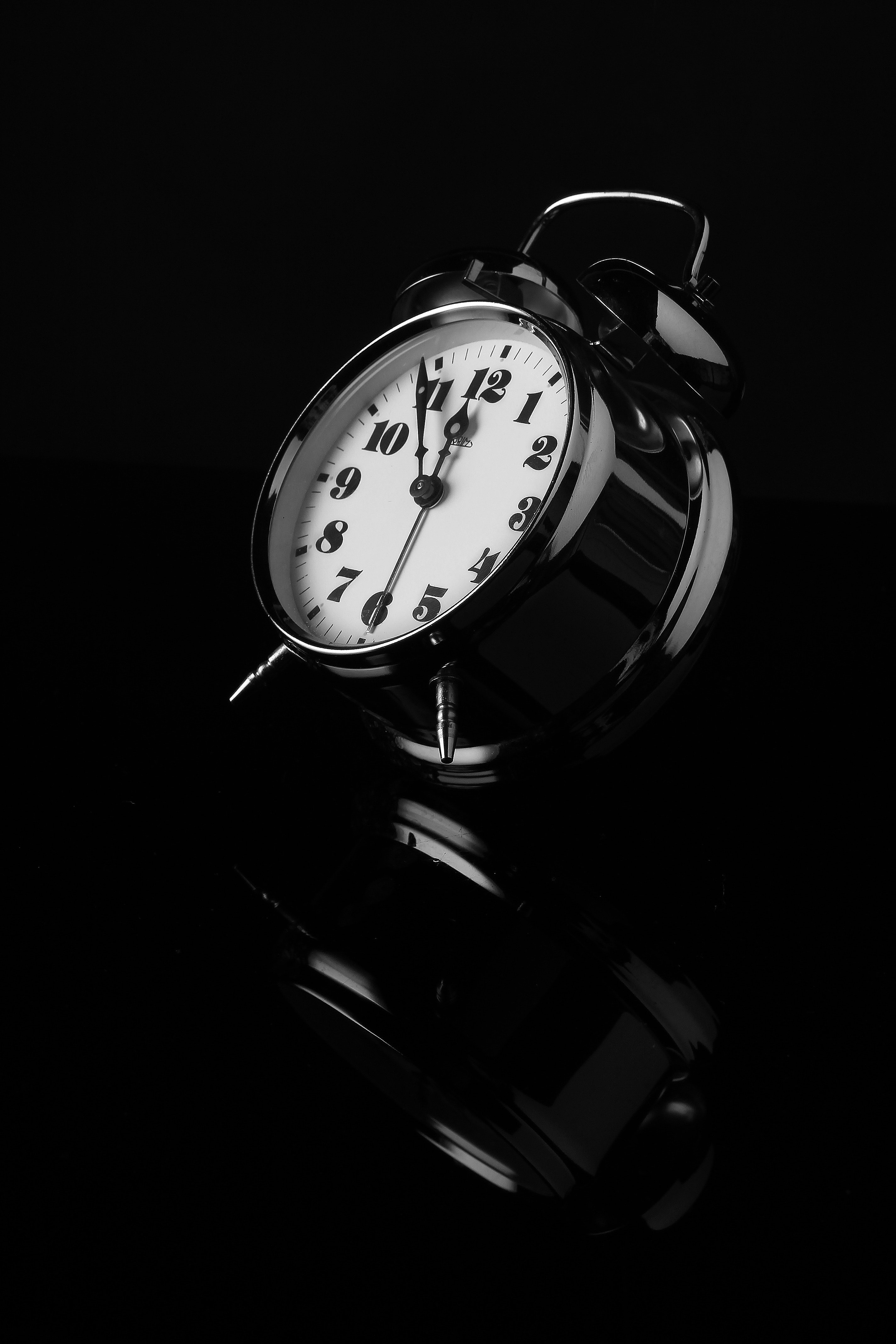 Black analog alarm clock photo