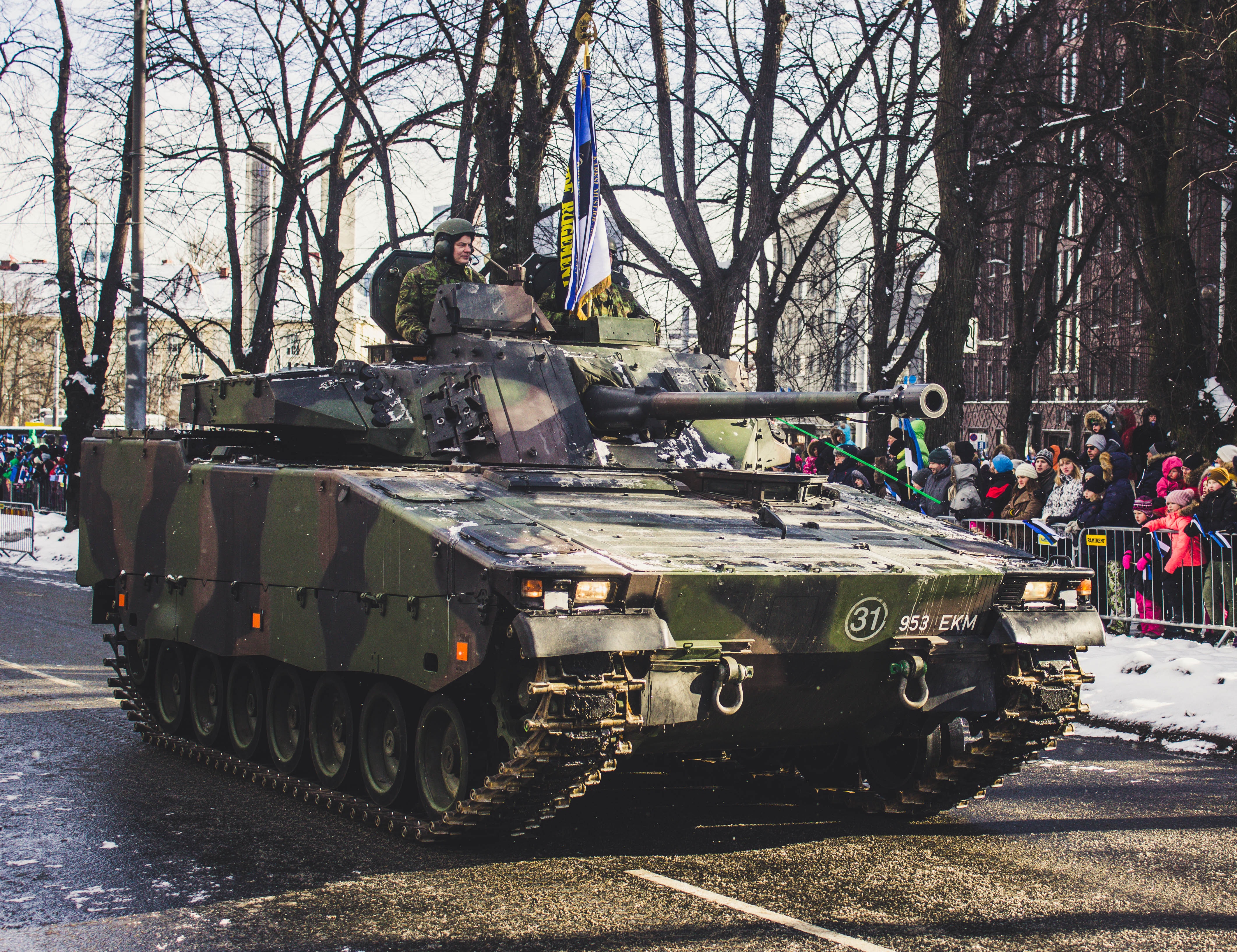 Black and green camouflage military tank parade photo