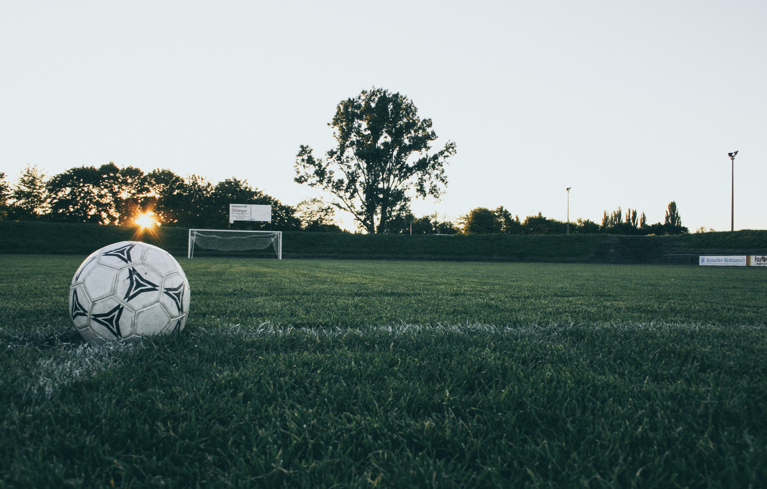 Black and White Soccer Ball on Green Grass Land during Daytime, Ball, Field, Grass, Sky, HQ Photo